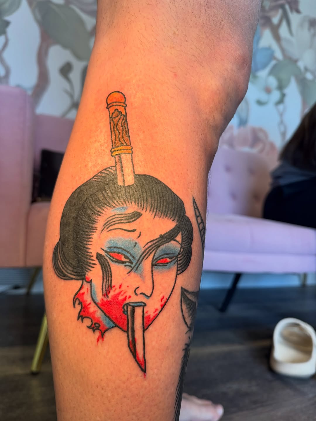 Geisha head with dagger neo-traditional tattoo on the forearm by Kinzi Brown