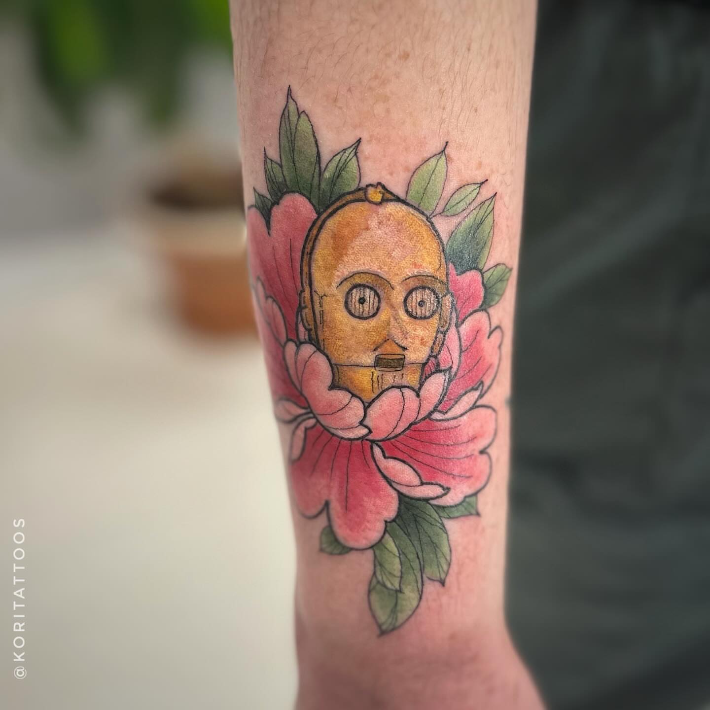 C-3PO with flowers new school tattoo on the forearm by Kori Millhimes