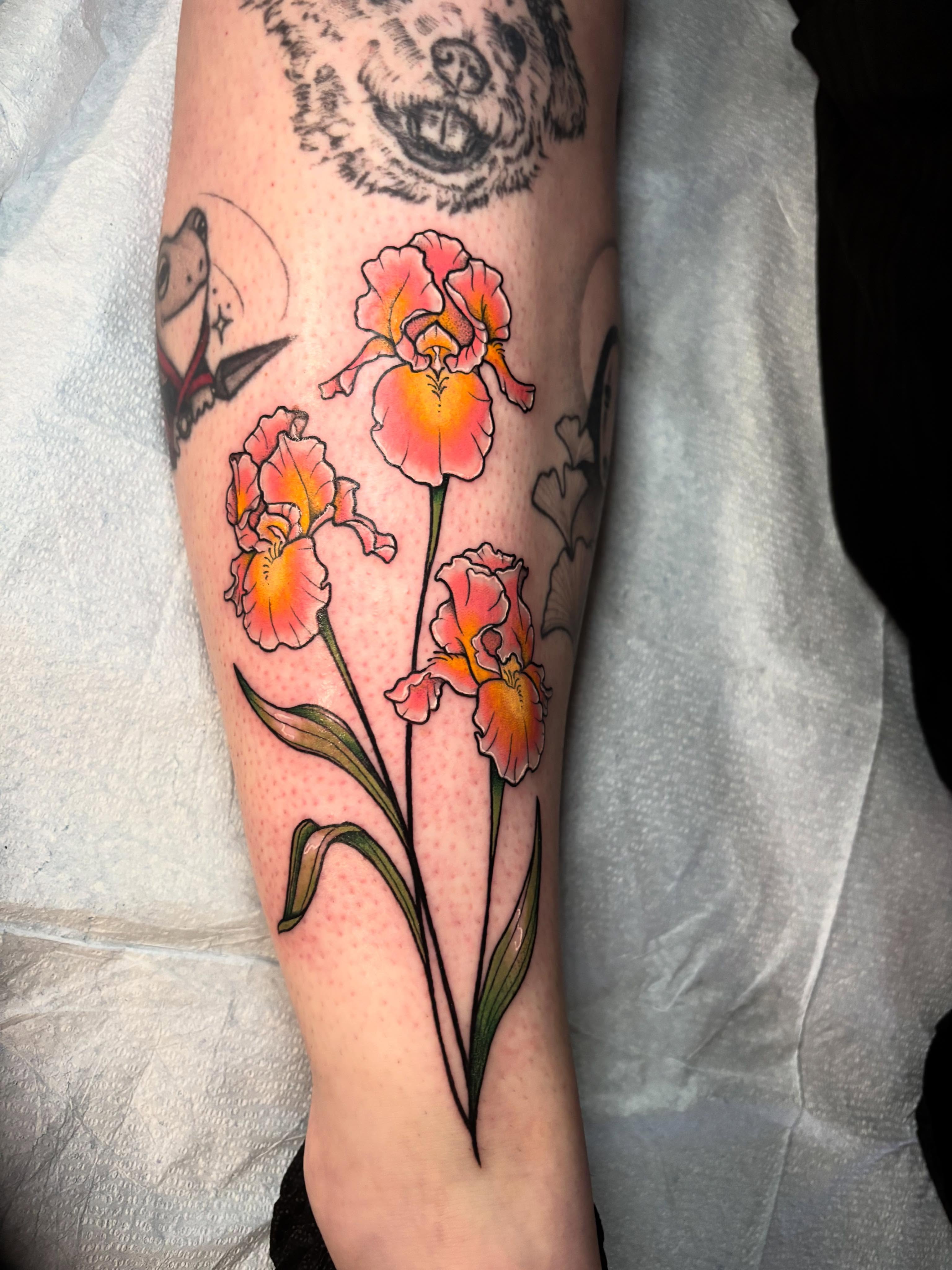 Iris flowers realism tattoo on the calf by Wren Hollow, Portland, Oregon