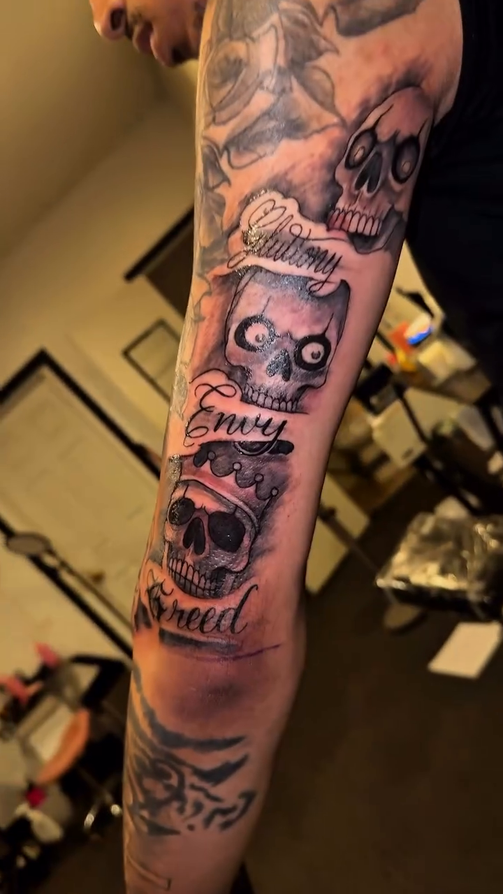 Skull and roses sleeve with lettering realism tattoo on the forearm by 2realink - Tattoo Artist
