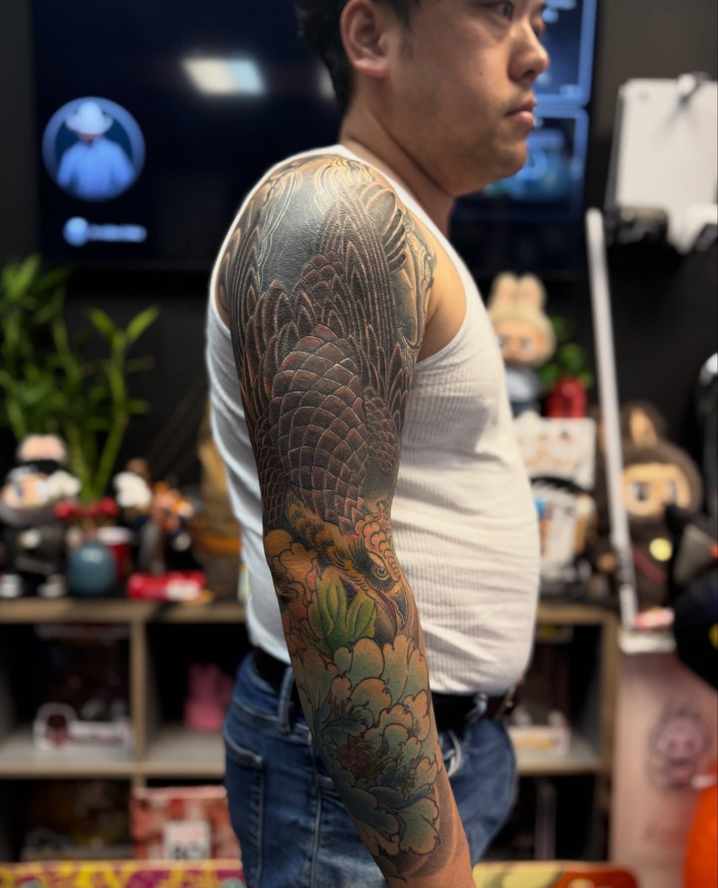 Dragon and flowers japanese irezumi tattoo on the upper arm by Zack Yang, Houston, Texas