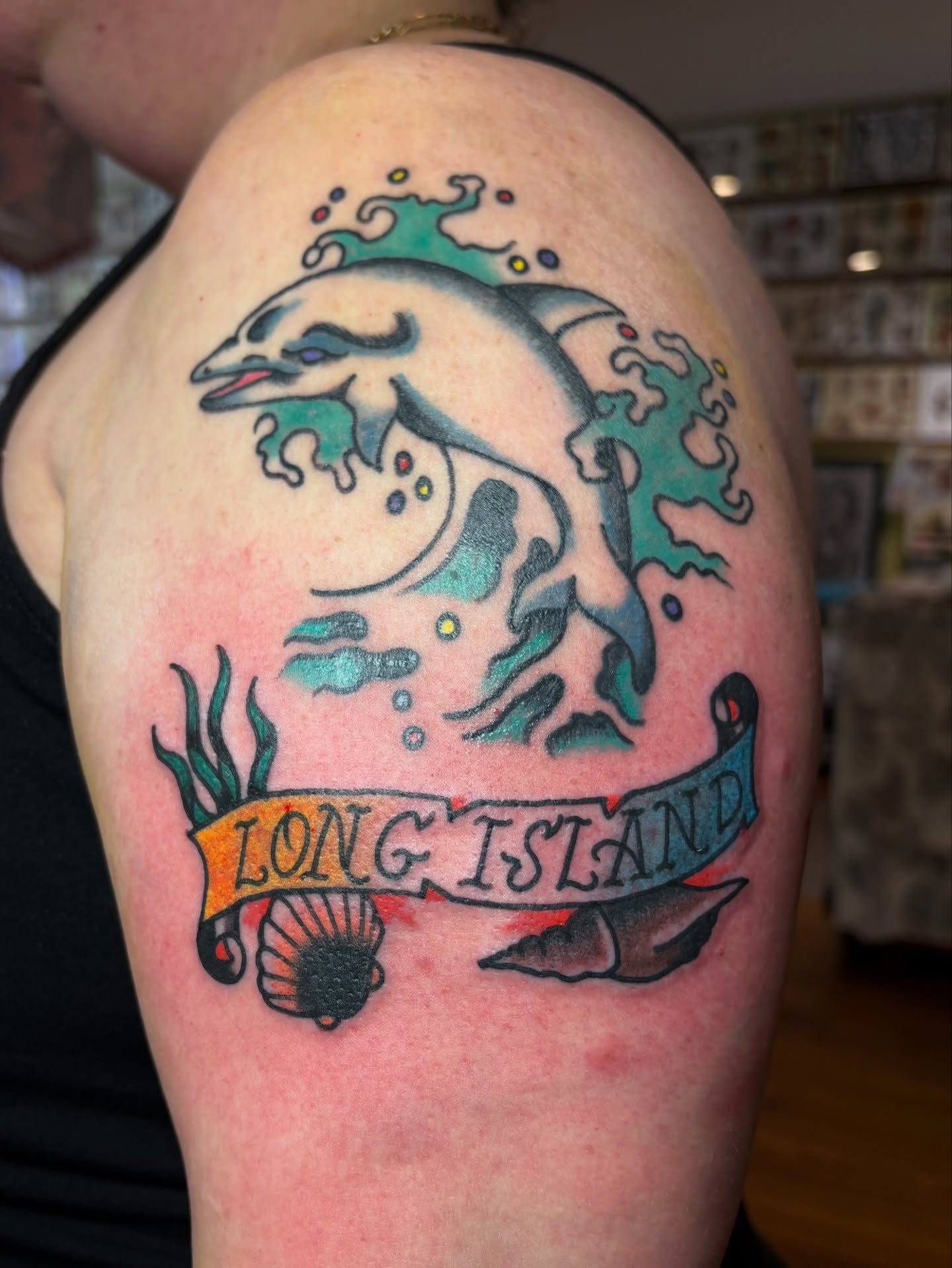 Dolphin and underwater scene American traditional tattoo on the shoulder by Jake Herbert, Knoxville, Tennessee