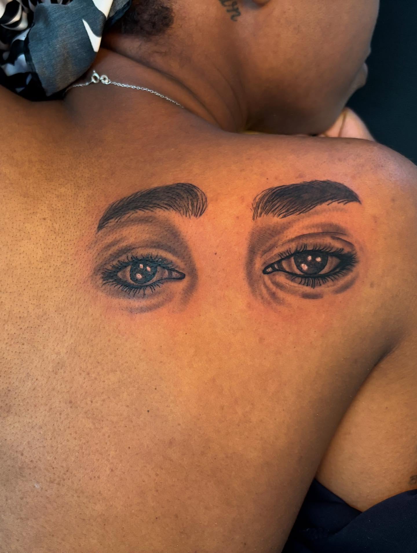 Eyes realism tattoo on the back by Inkys Tatts