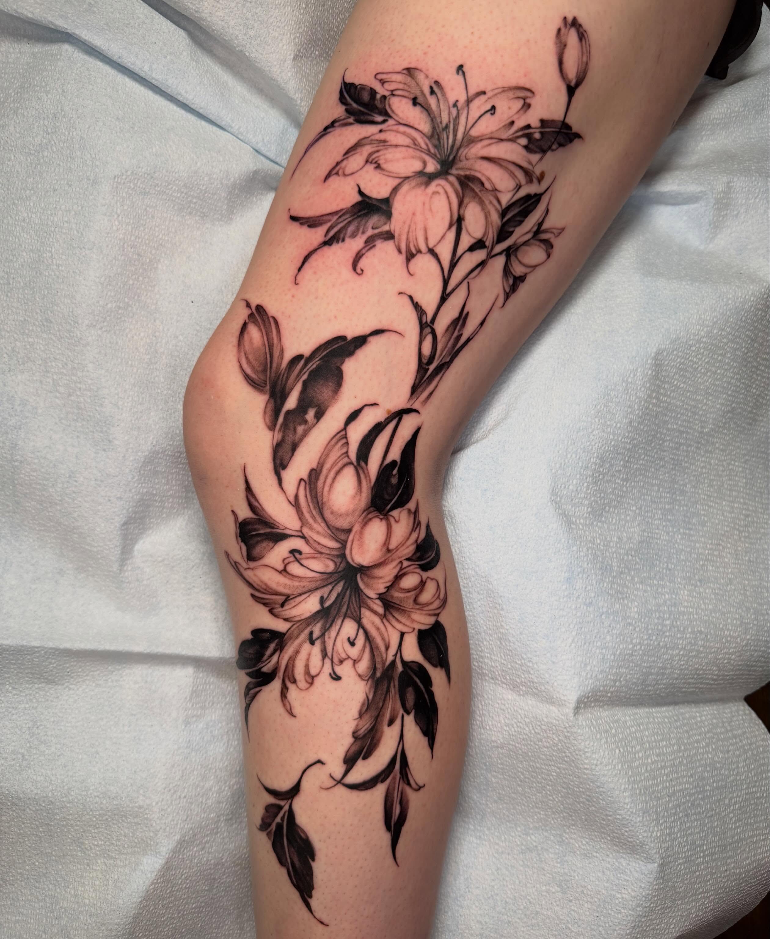 Floral arrangement realism tattoo on the forearm by James Nelson