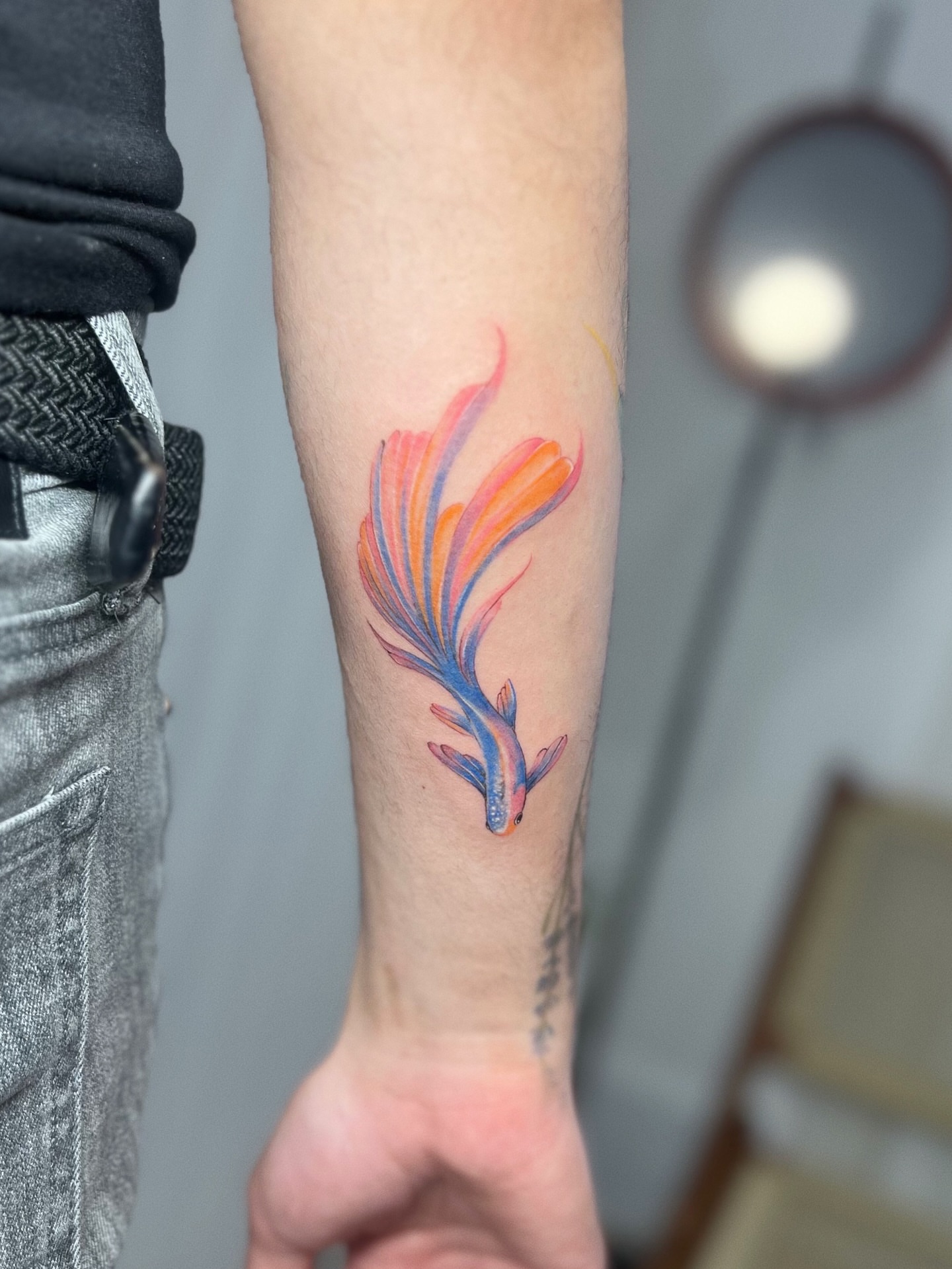 Fish watercolor tattoo on the forearm by Soy 🫛