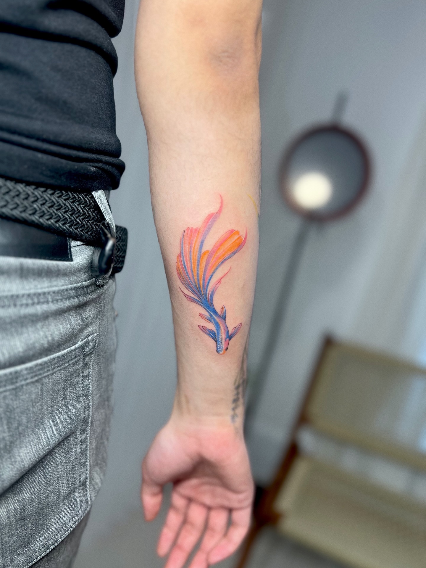 Feather watercolor tattoo on the forearm by Soy 🫛