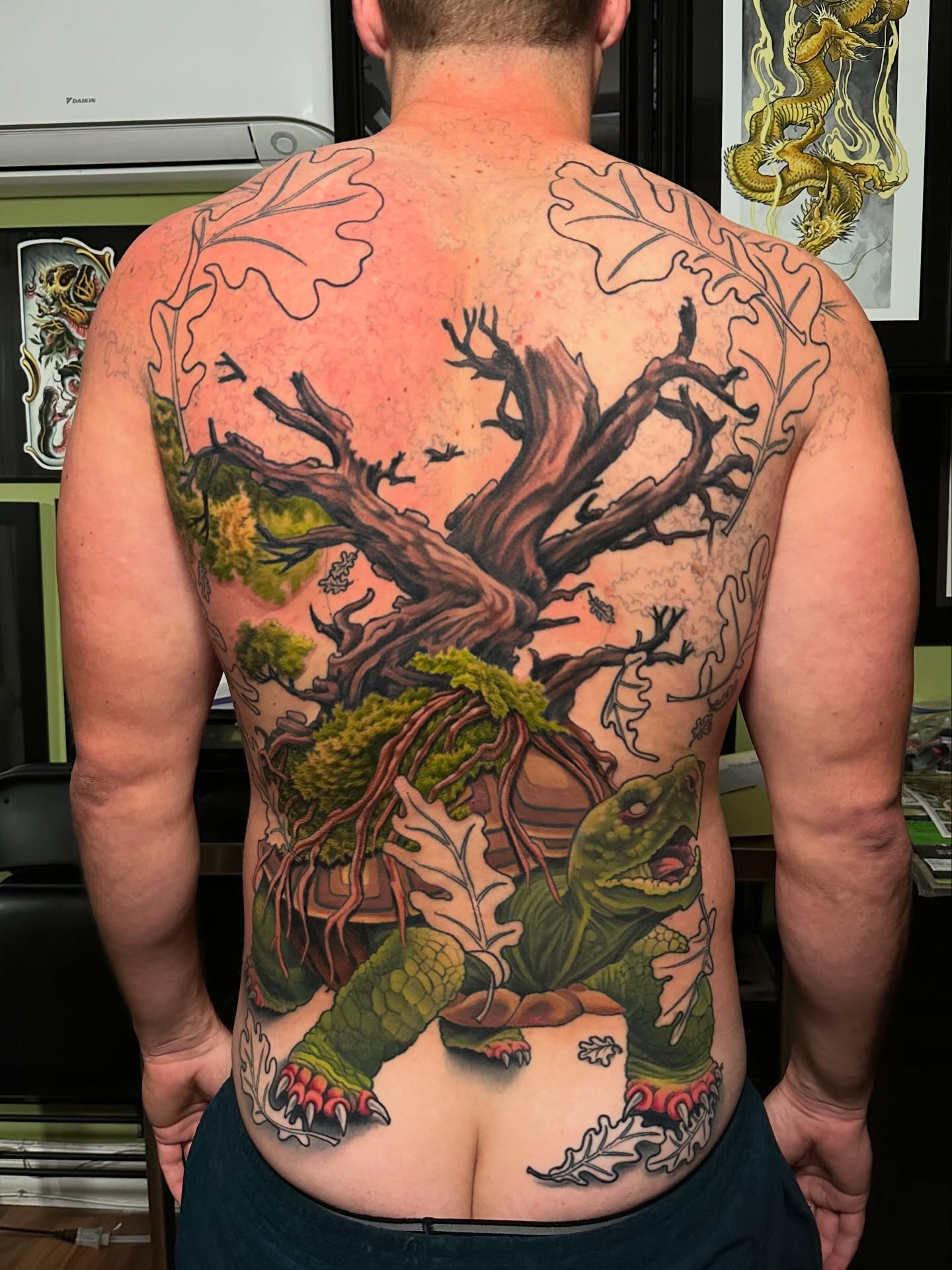 Tree and turtle realism tattoo on the back by Trevor Burtz