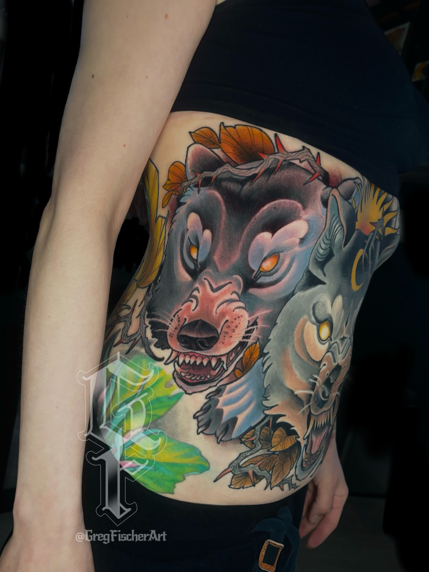 Wolf American traditional tattoo on the thigh by Greg Fischer