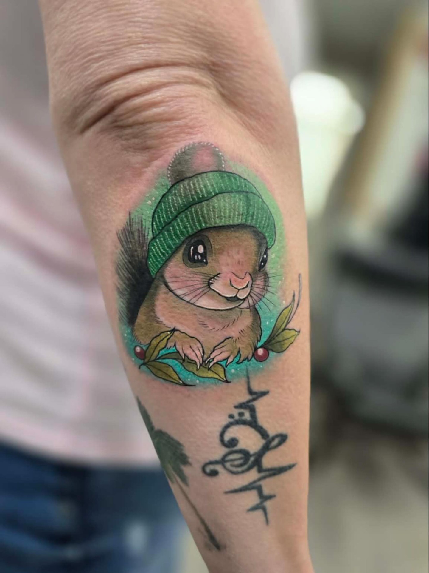 Chibi squirrel realism tattoo on the forearm by Kodi Klo