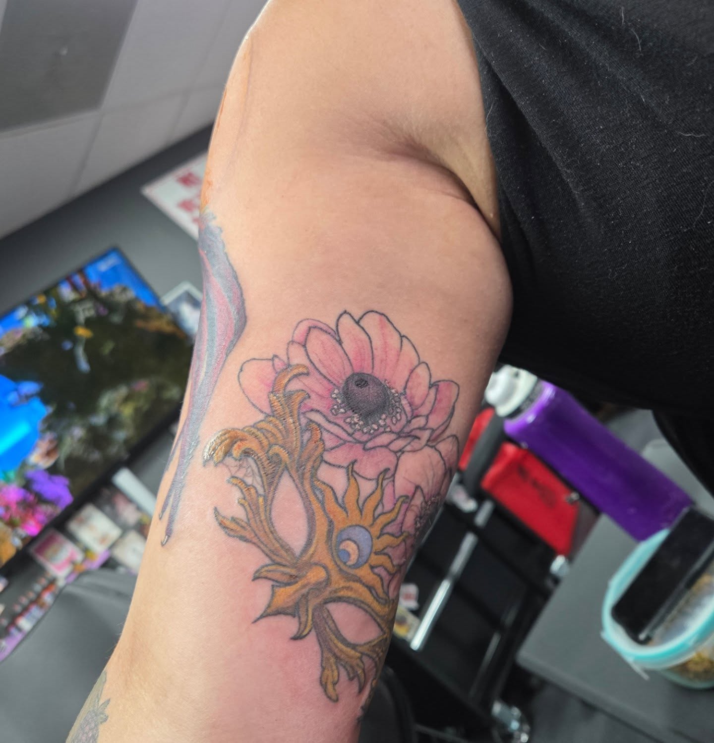Flower and sun realism tattoo on the forearm by Trinity Renee