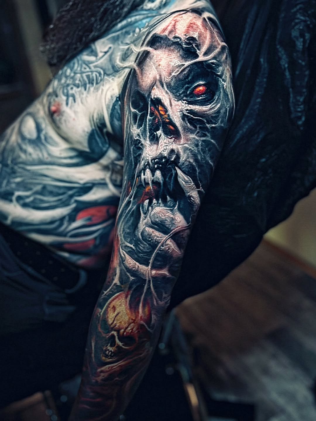 Demonic skull with flames dark art tattoo on the forearm by David Jorquera