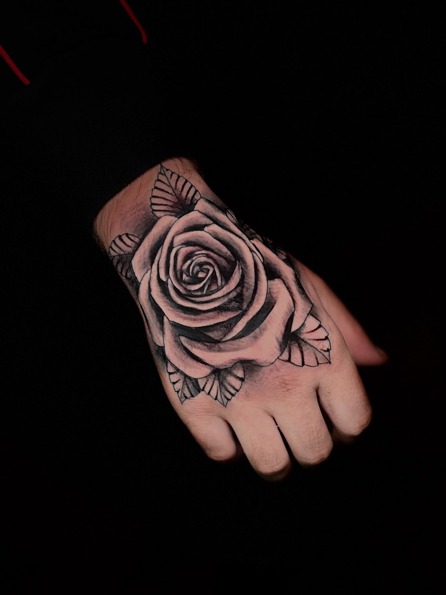 Rose black and grey tattoo on the hand by @tatt2st
