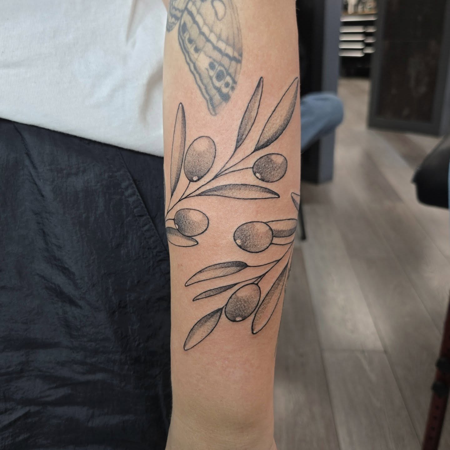 Olive branch black and grey tattoo on the forearm by Britty Love, Nashville, Tennessee