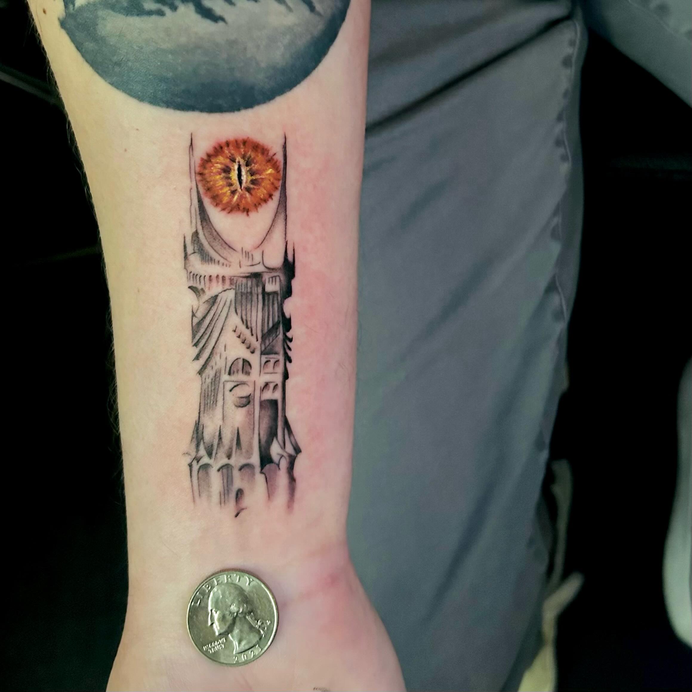 Eye tower dark realism tattoo on the forearm by Jonny Tattoo PHX AZ