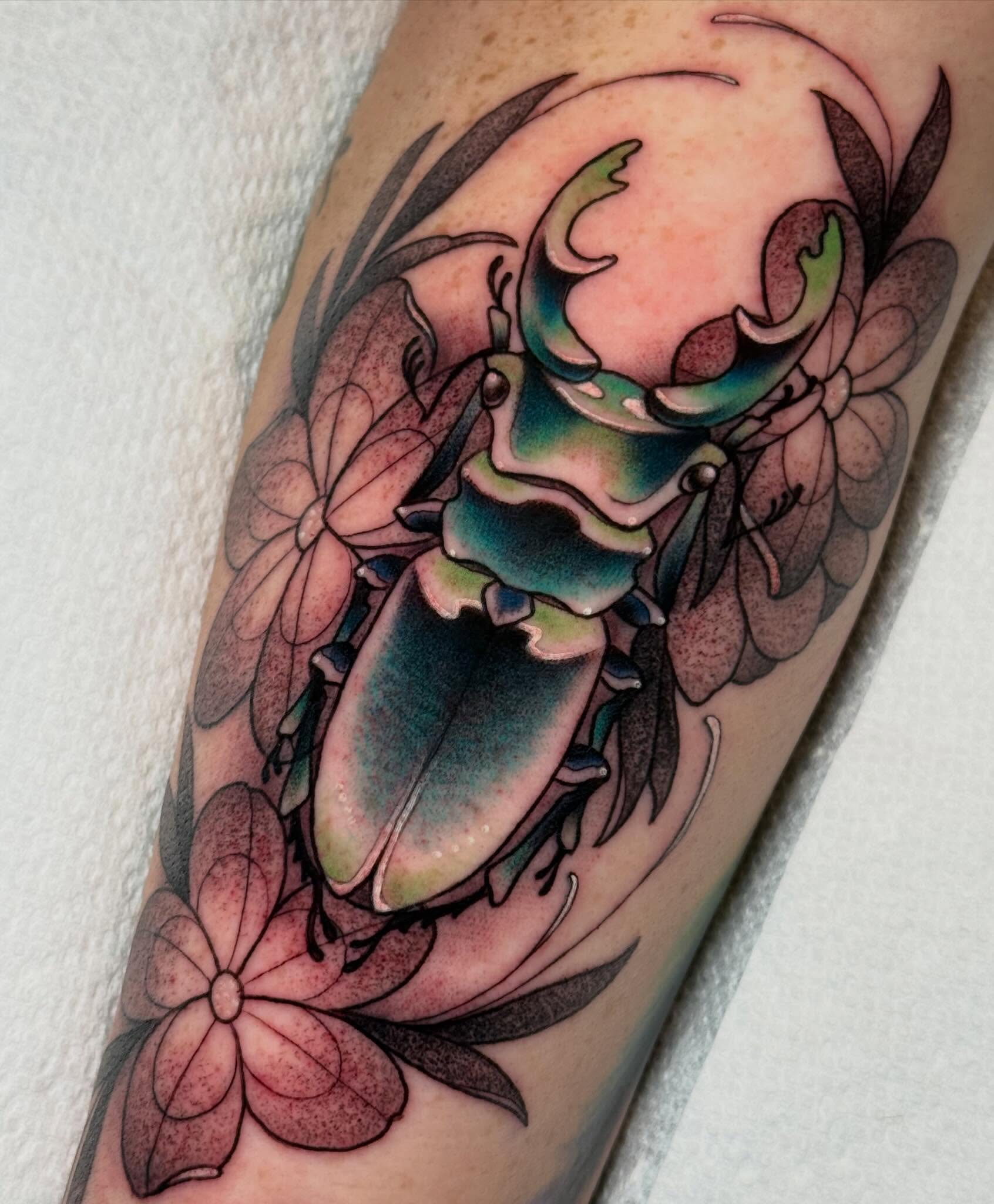 Stag beetle realism tattoo on the forearm by Kayla Warren