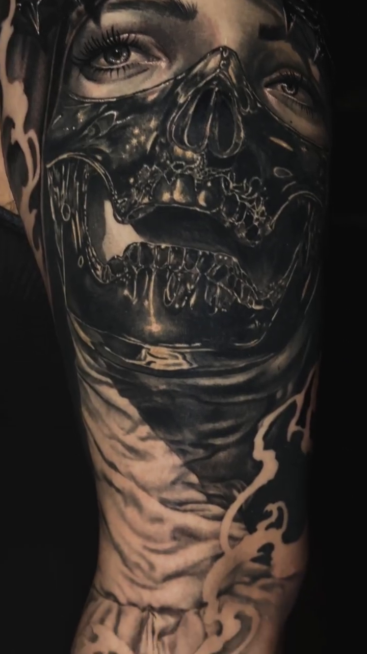 Woman with skull mask dark realism tattoo by Bailey Hancock