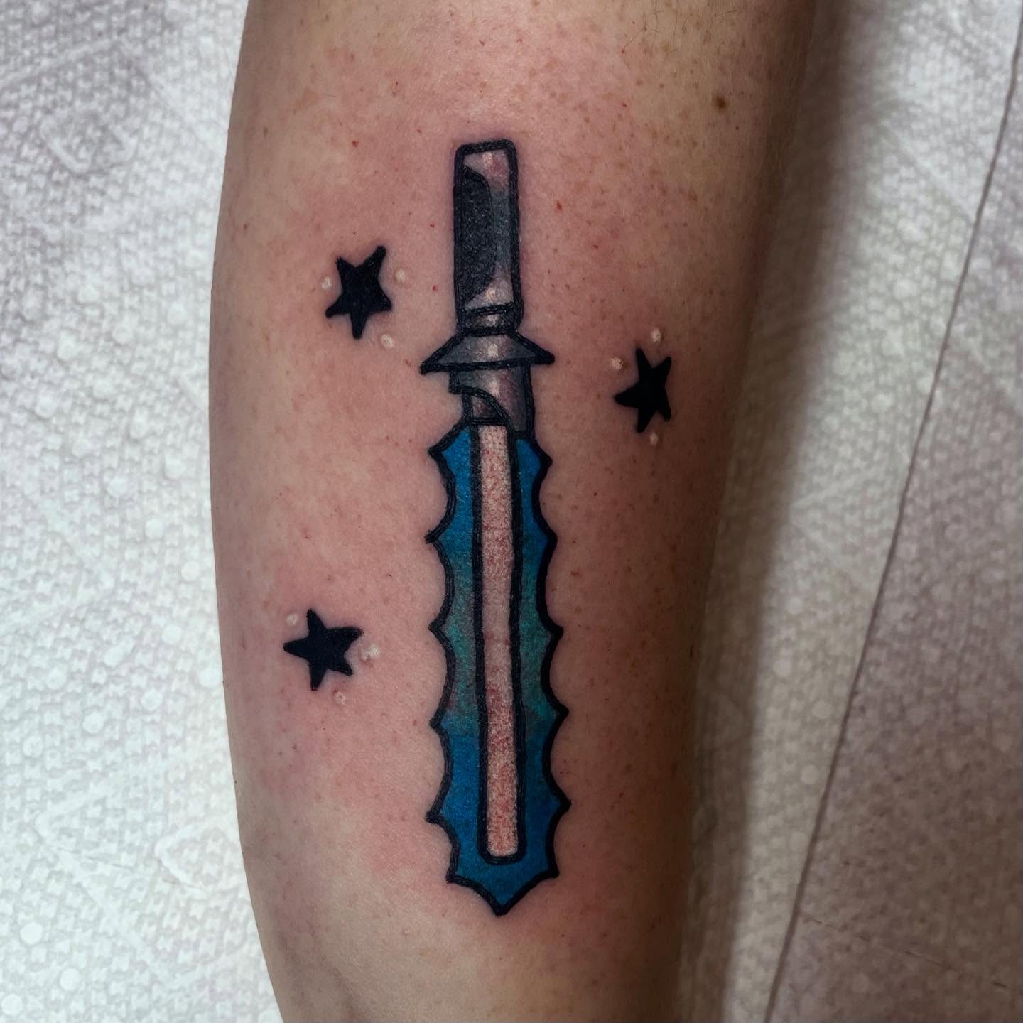 Knife neo-traditional tattoo on the forearm by Robert Morrow