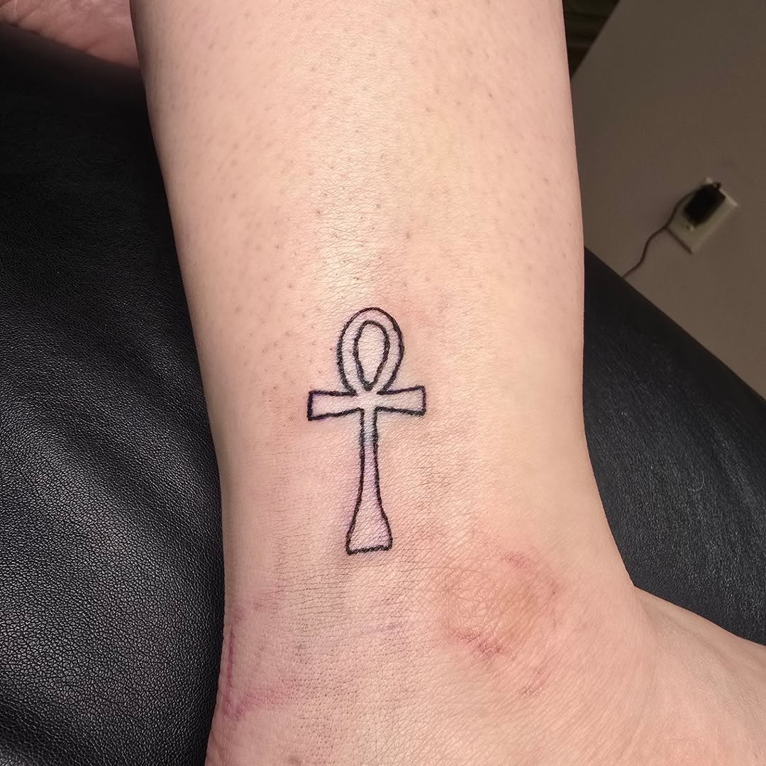 Ankh symbol tattoo on the forearm by Catherine B