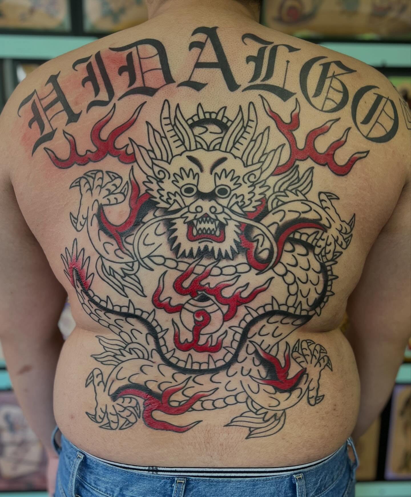 Dragon American traditional tattoo on the back by Mikey Montoya