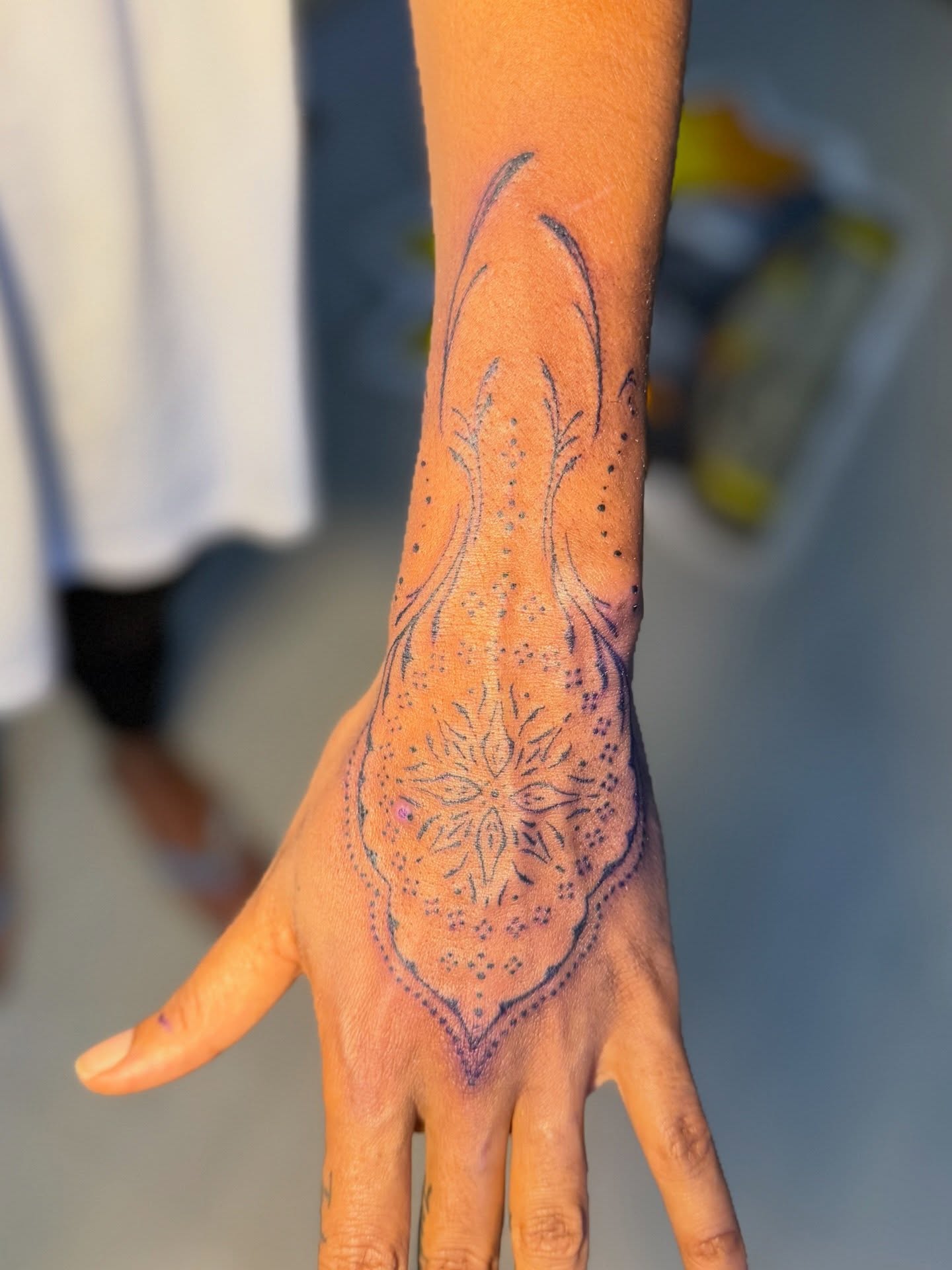 Floral pattern dotwork tattoo on the hand by David Yancy III