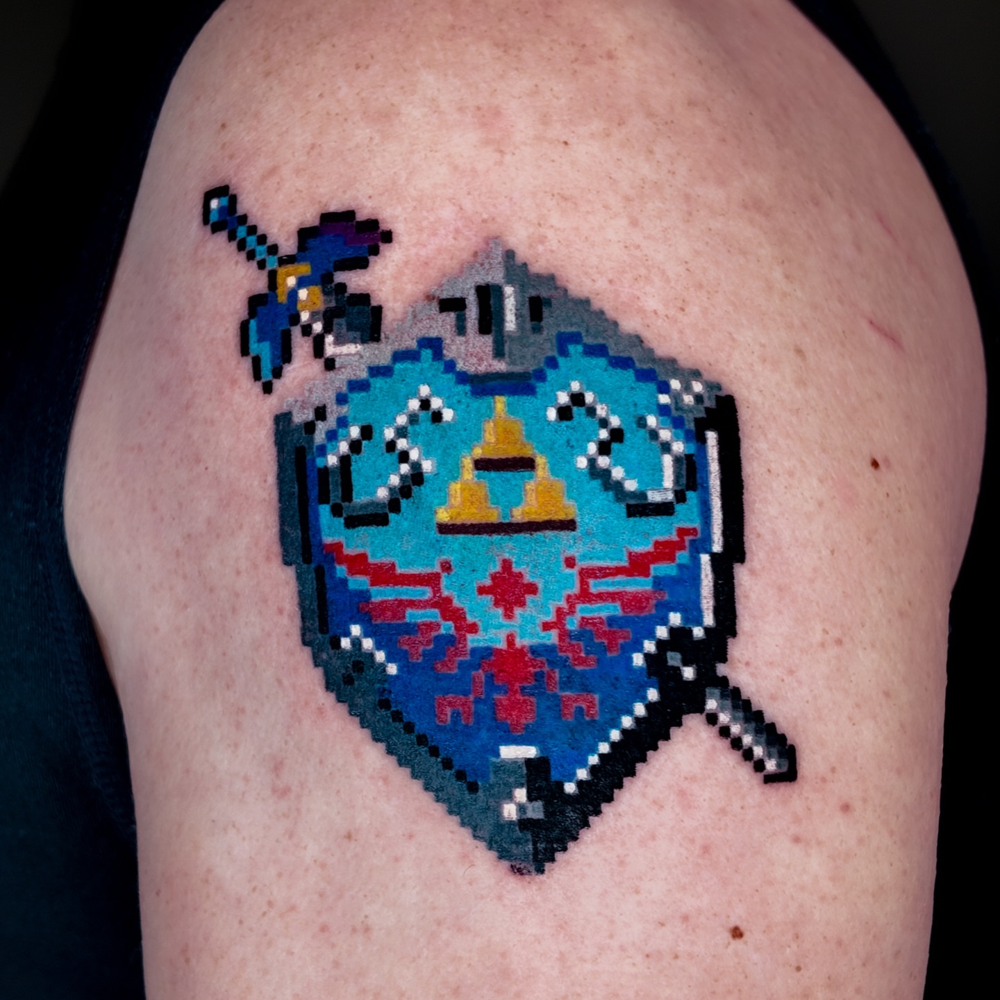 Hylian Shield dotwork tattoo on the shoulder by m r p i x e l ๐ธ๐ฌ