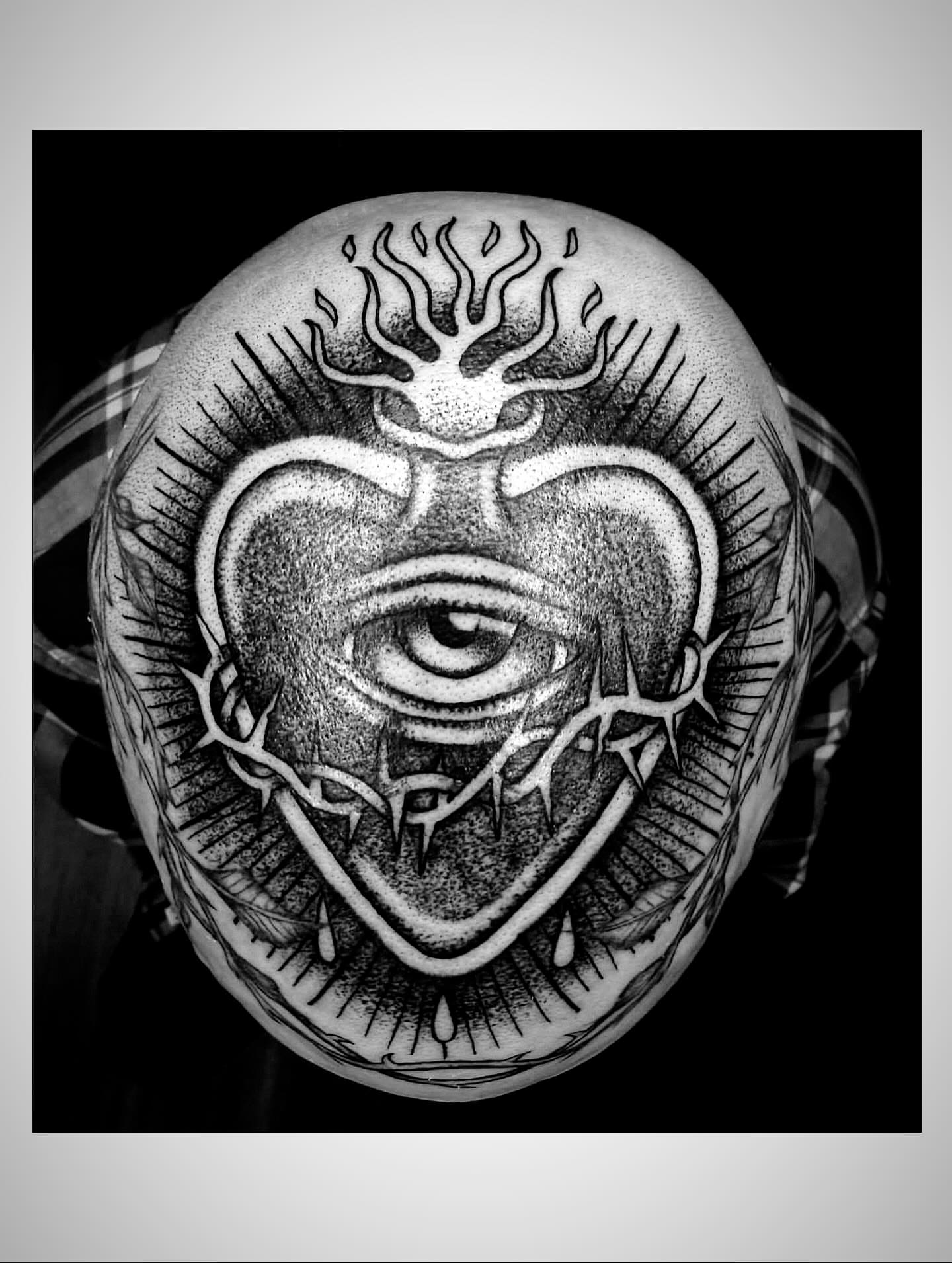 Eye with crown dotwork tattoo on the head by Zach Andrews
