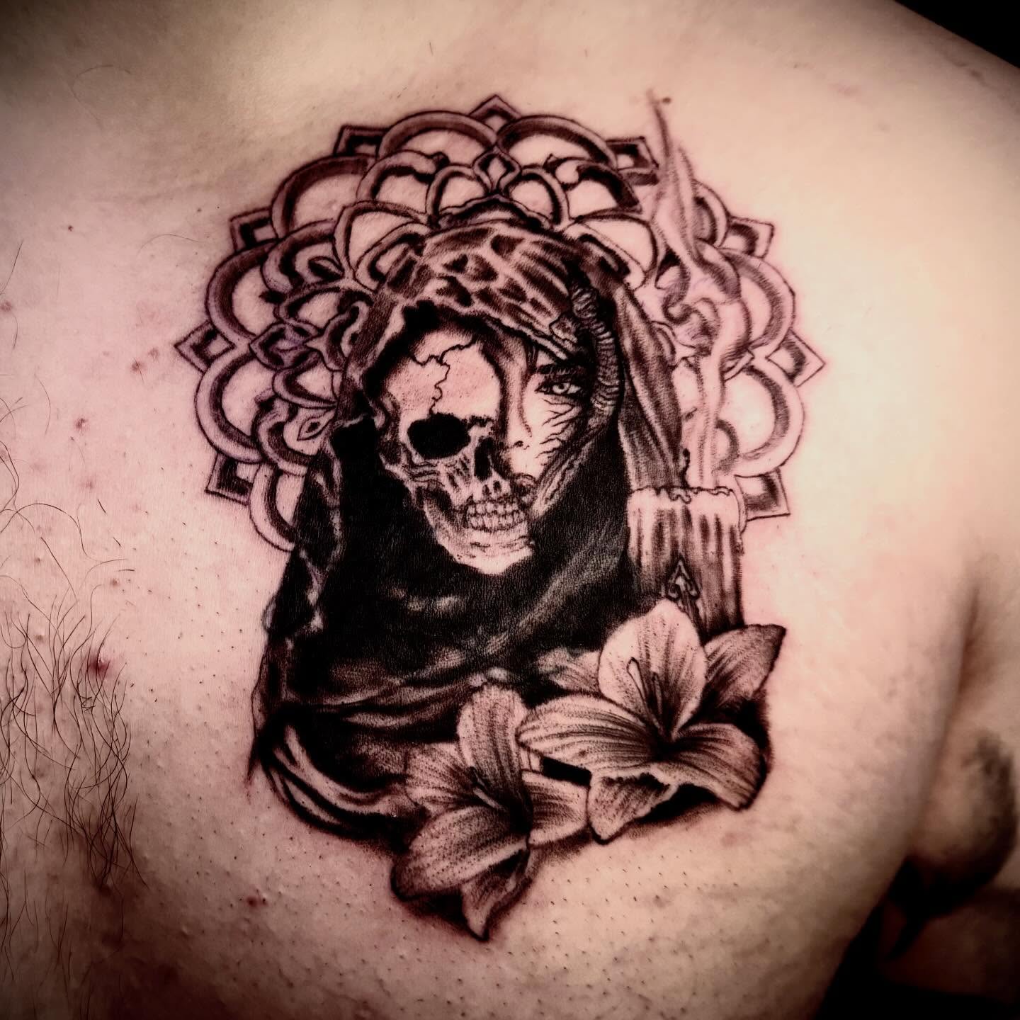 Skull with floral crown realism tattoo on the chest by C. Compa