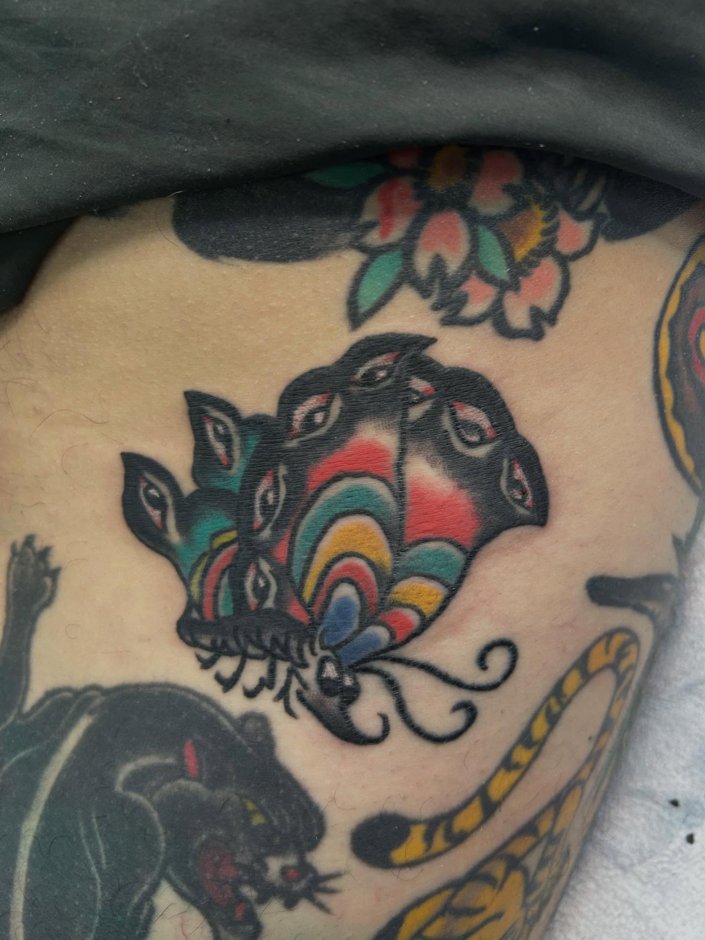 Butterfly American traditional tattoo on the thigh by Stogie Tony
