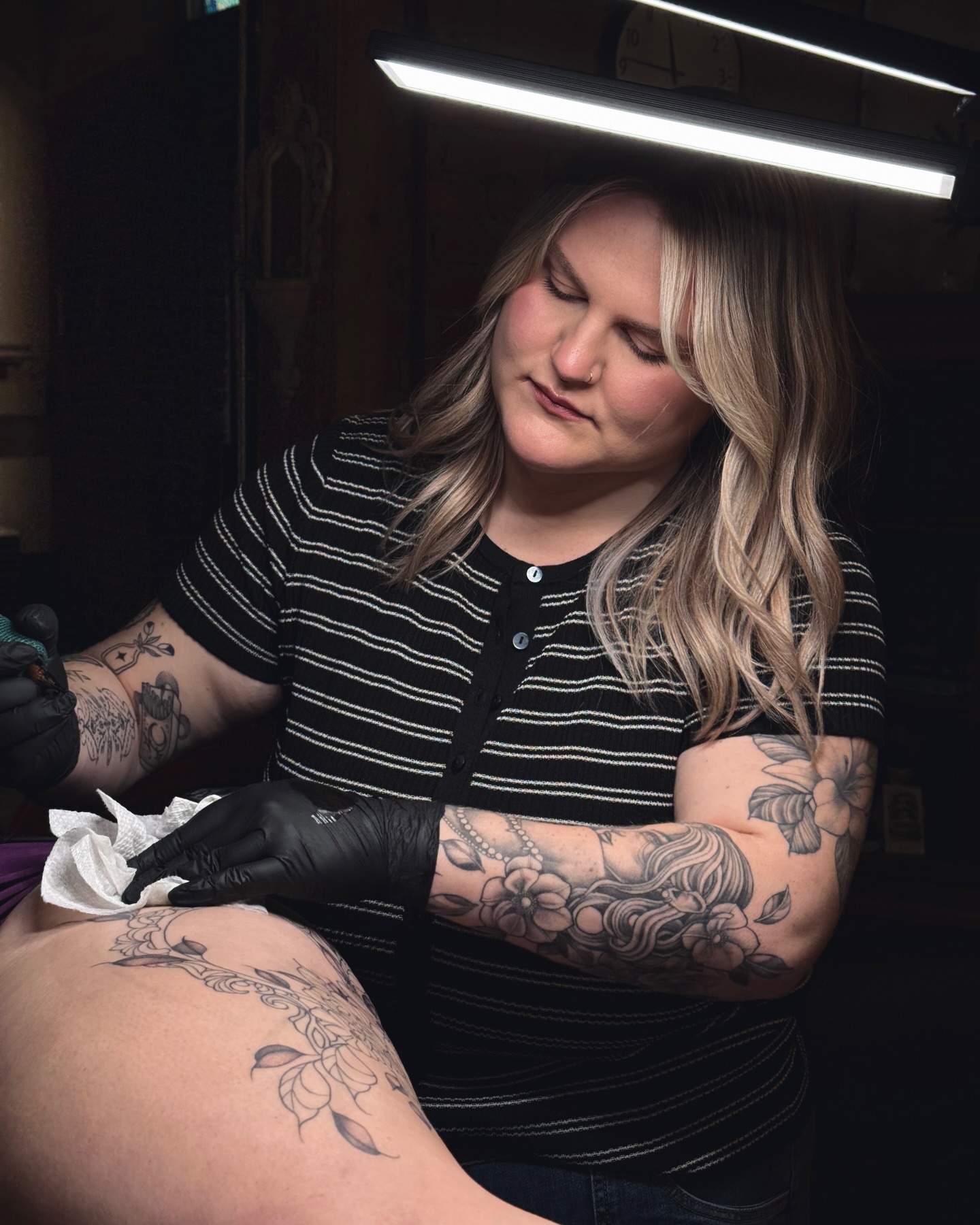 Floral design black and grey tattoo on the thigh by Jessica Bloom