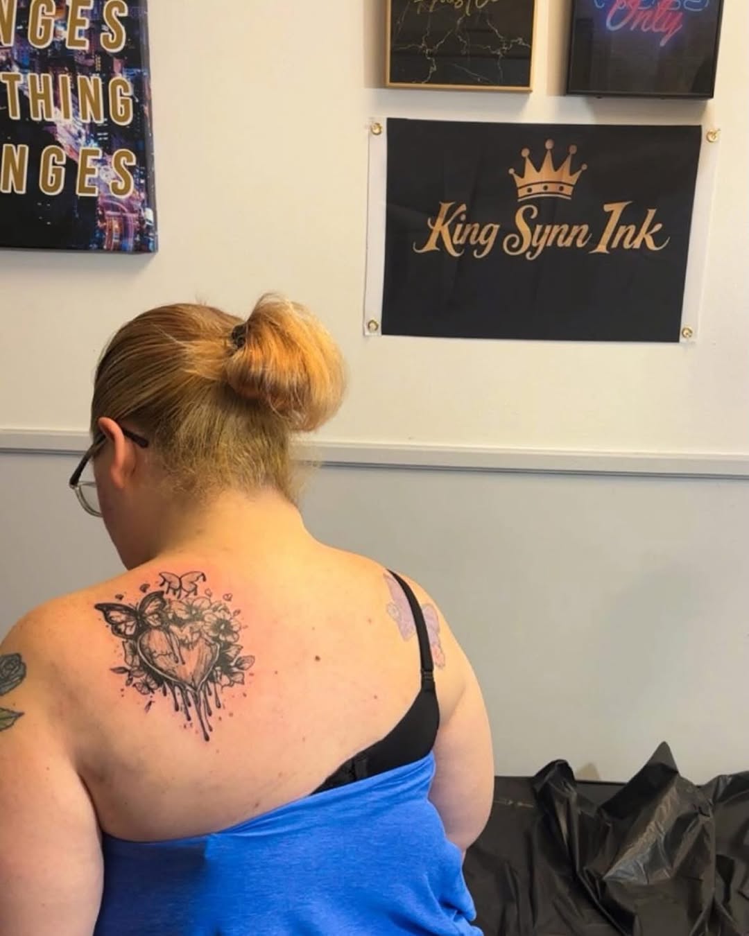 Heart with flowers and butterflies tattoo on the back by Syneca Wilson, Acton, Massachusetts
