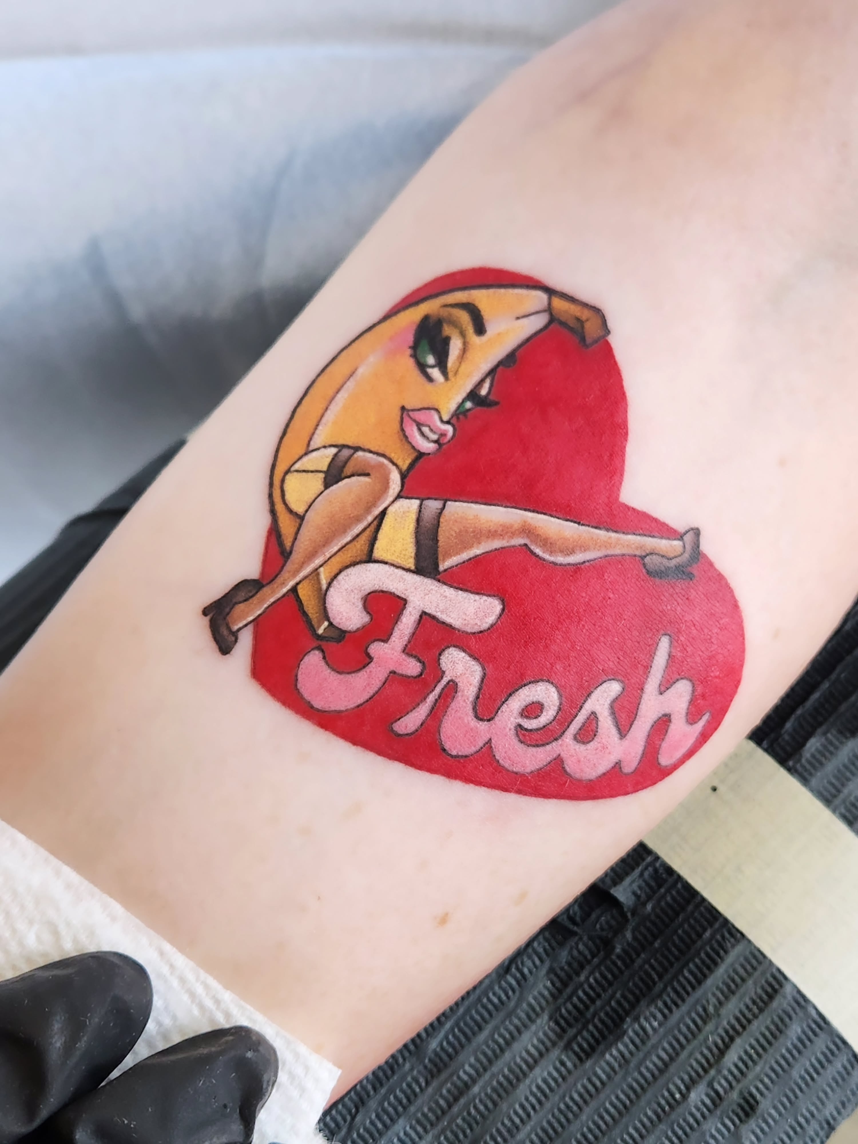 Banana girl new school tattoo on the forearm by Amanda Boyd - Duh!