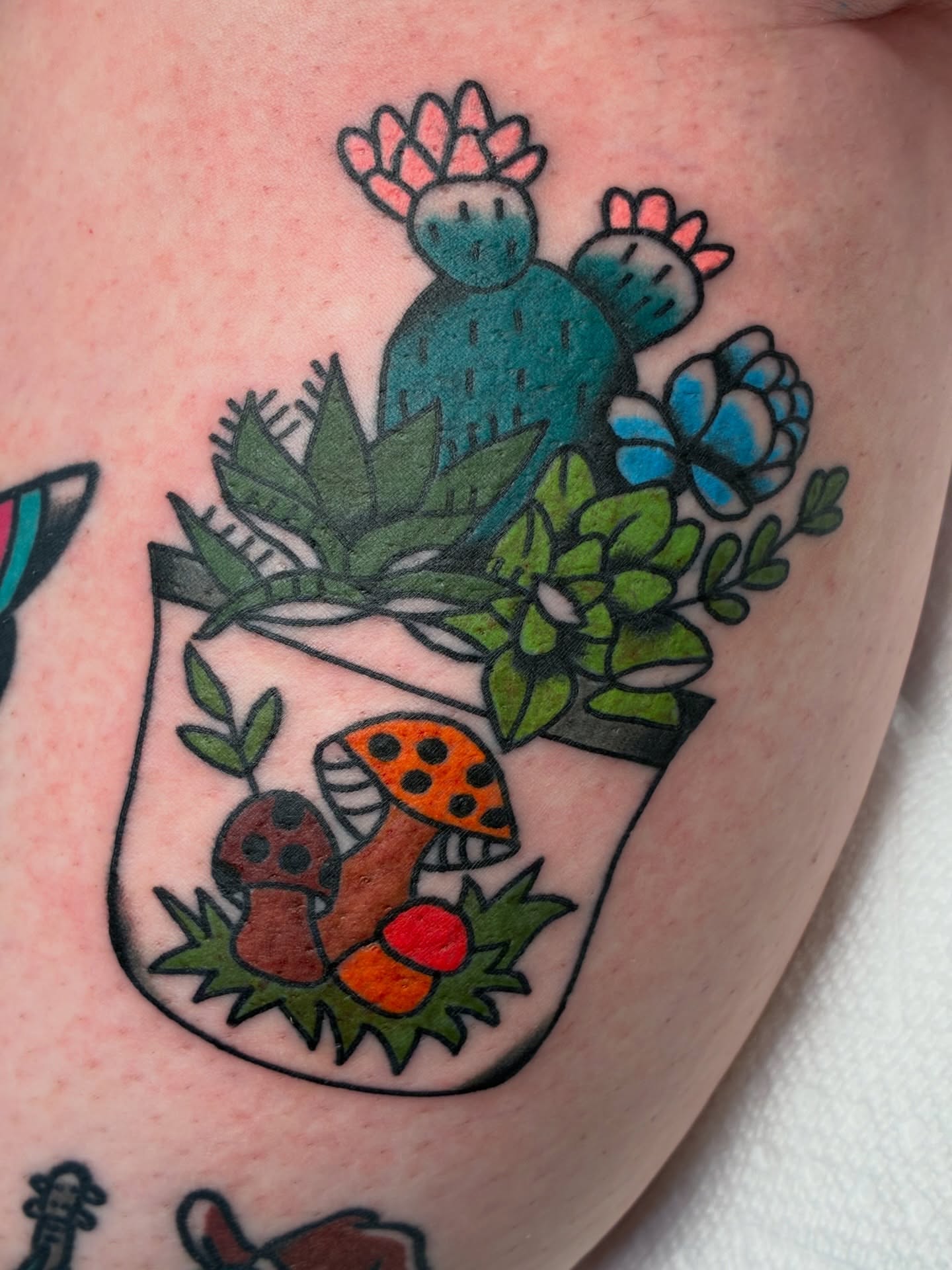 Cactus and mushrooms American traditional tattoo on the thigh by Sav Robinson