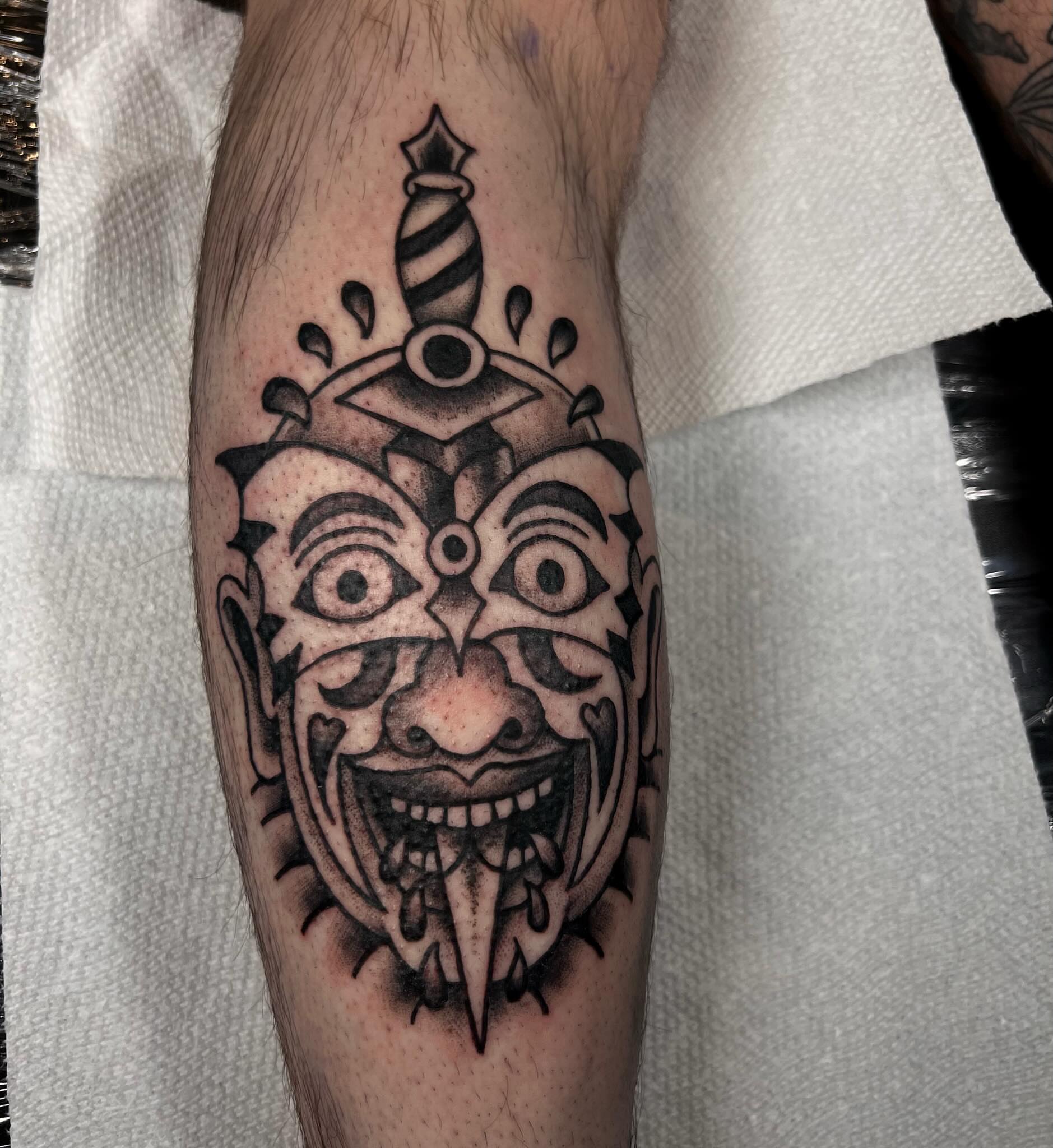 Clown mask American traditional tattoo on the forearm by Ady Paige