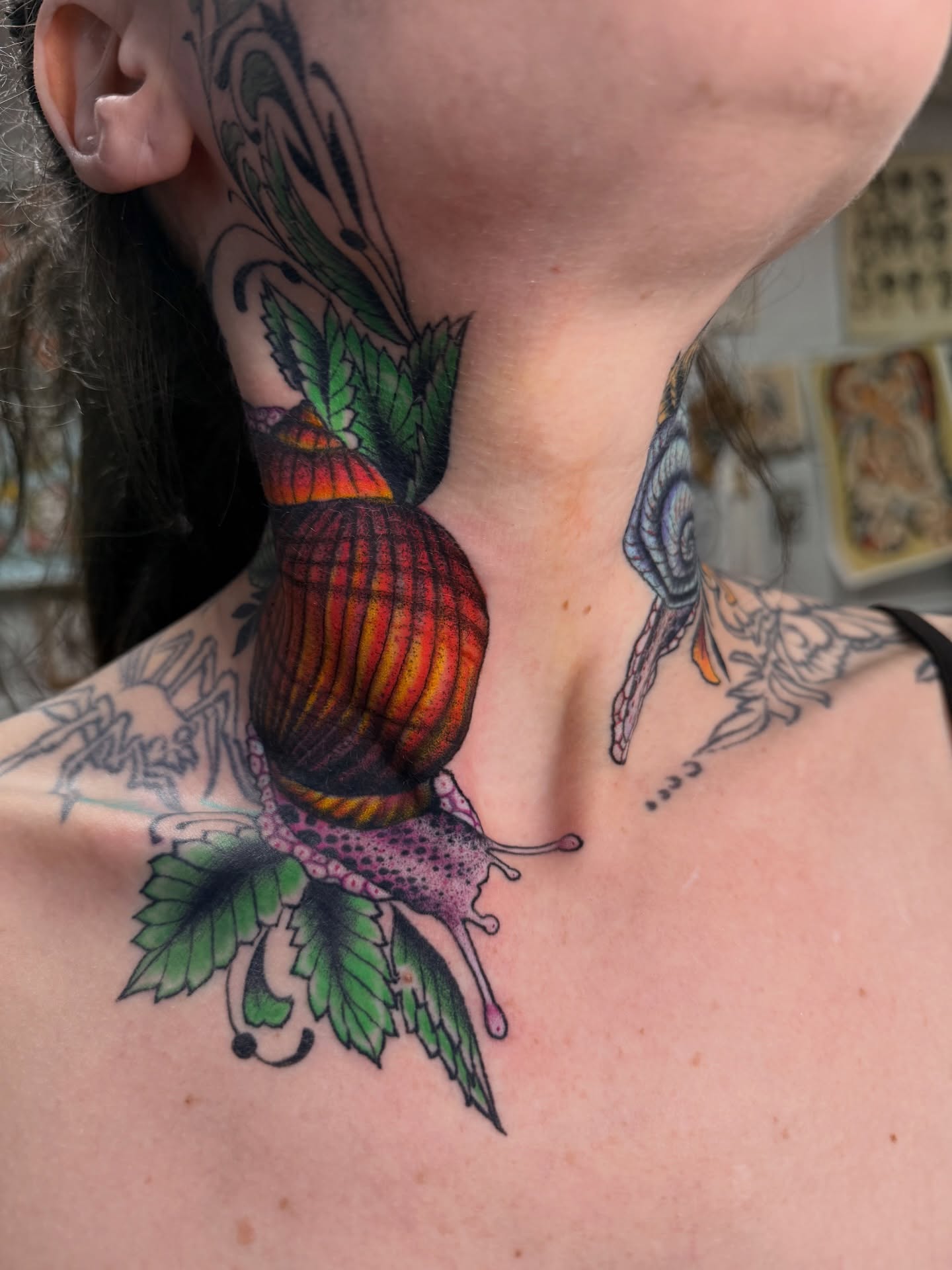 Snail and leaf American traditional tattoo on the neck by Jhon
