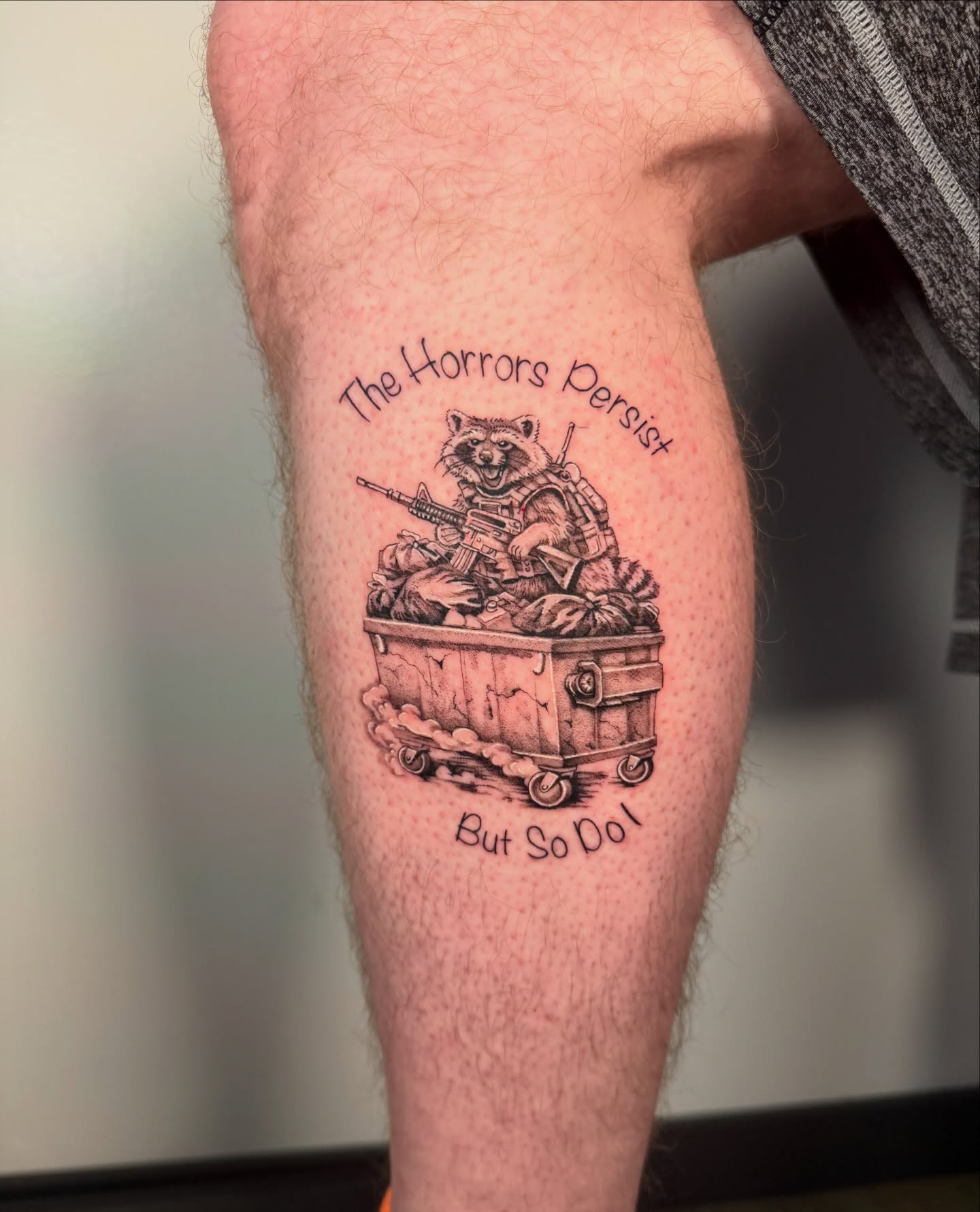 Horror raccoon black and grey tattoo on the thigh by Cyn