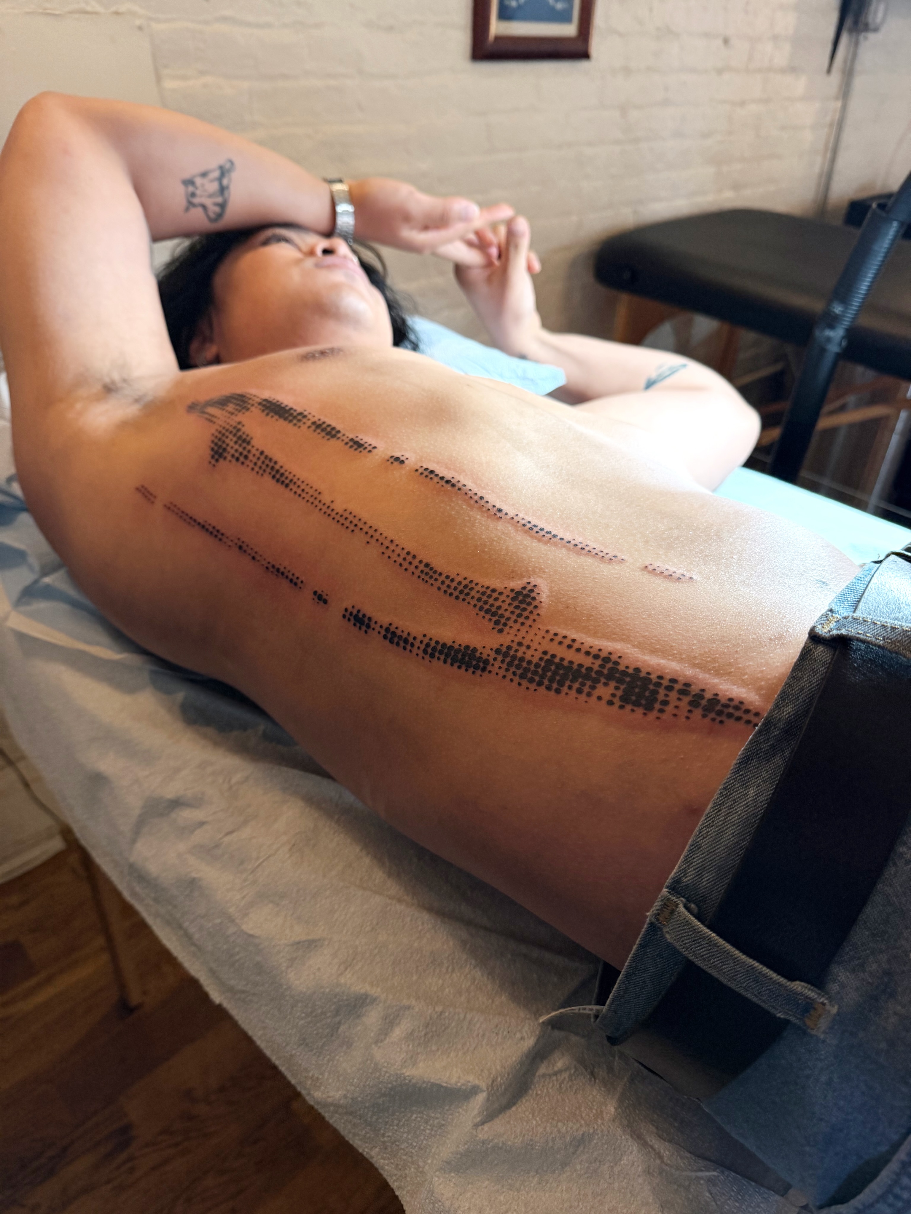 Abstract pattern dotwork tattoo on the torso by Haza