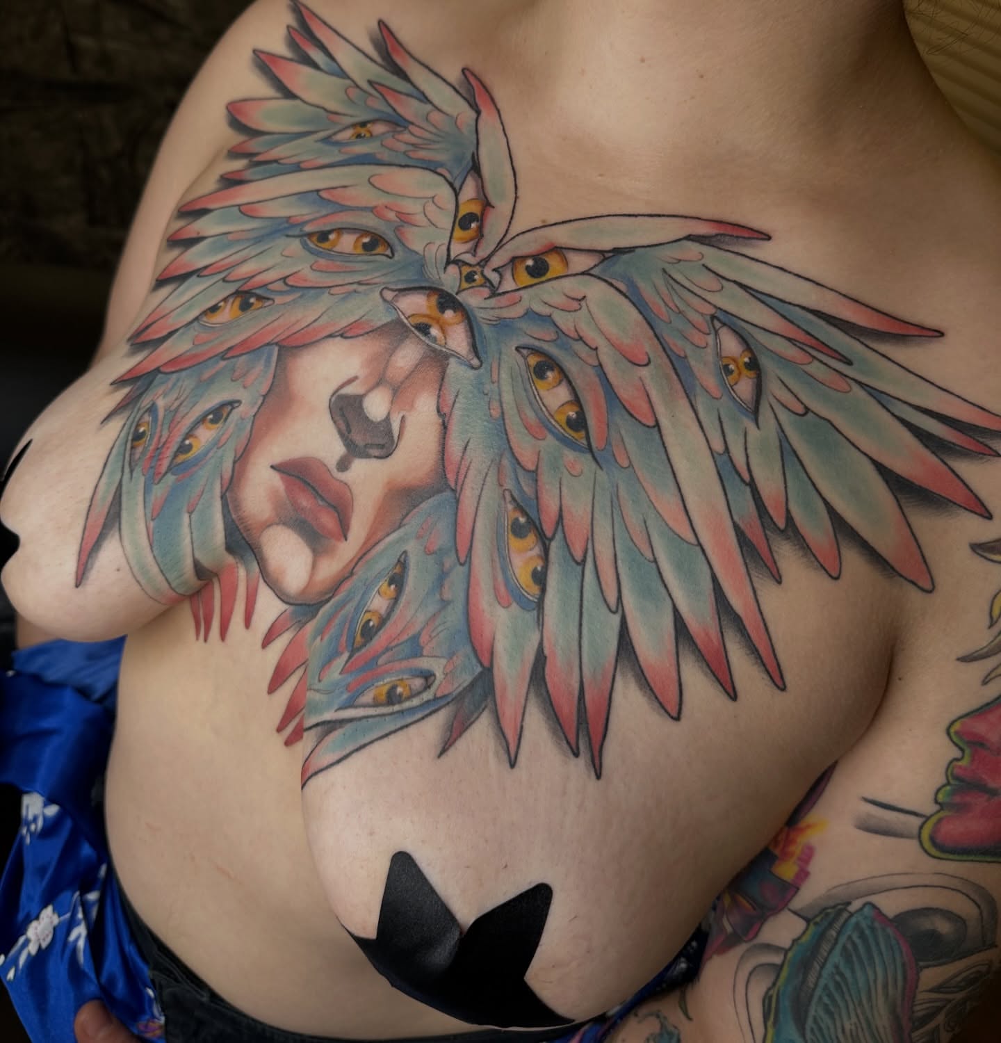 Owl and face American traditional tattoo on the chest by Jenn Golgan