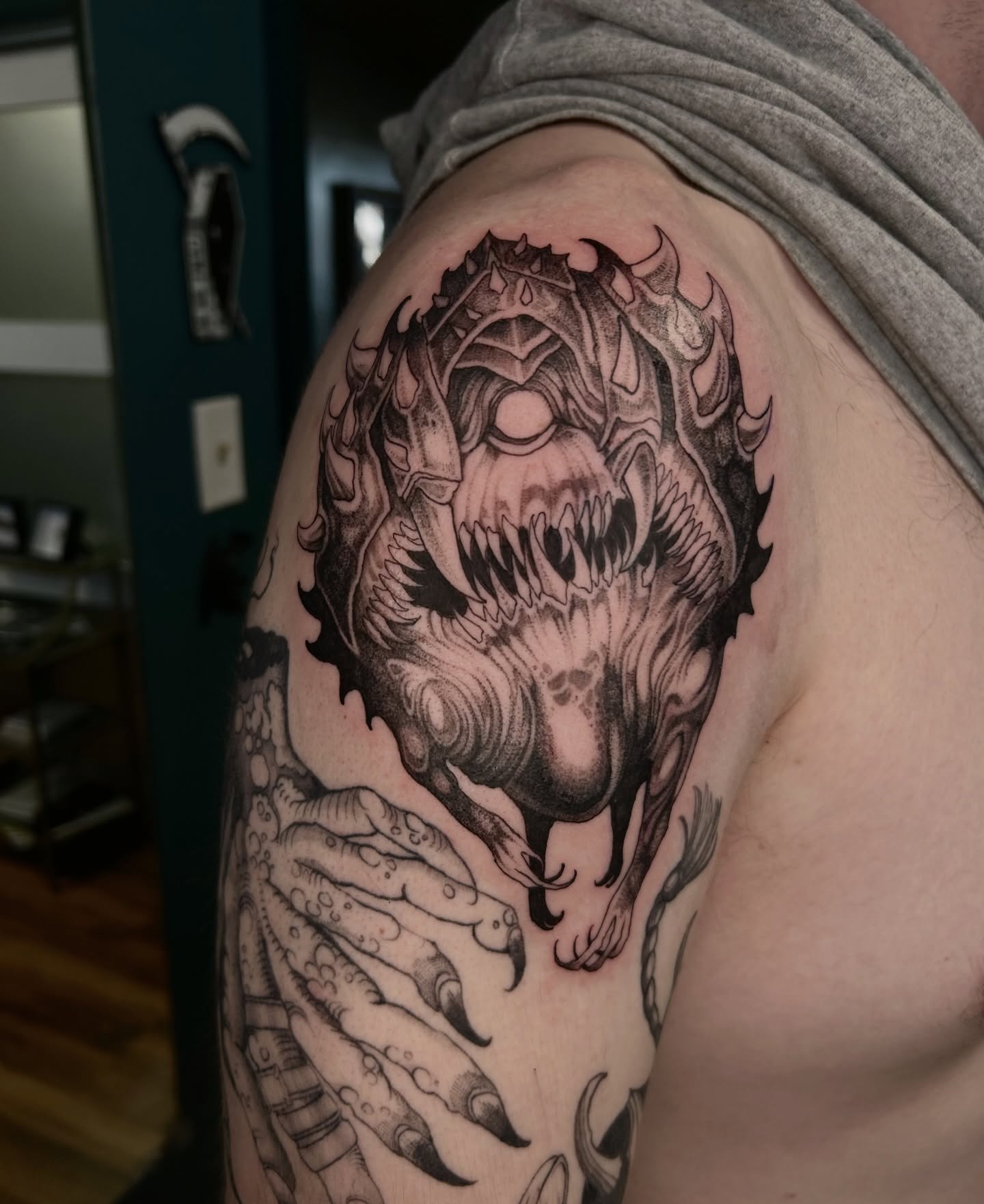 Demon dark realism tattoo on the shoulder by Magnus