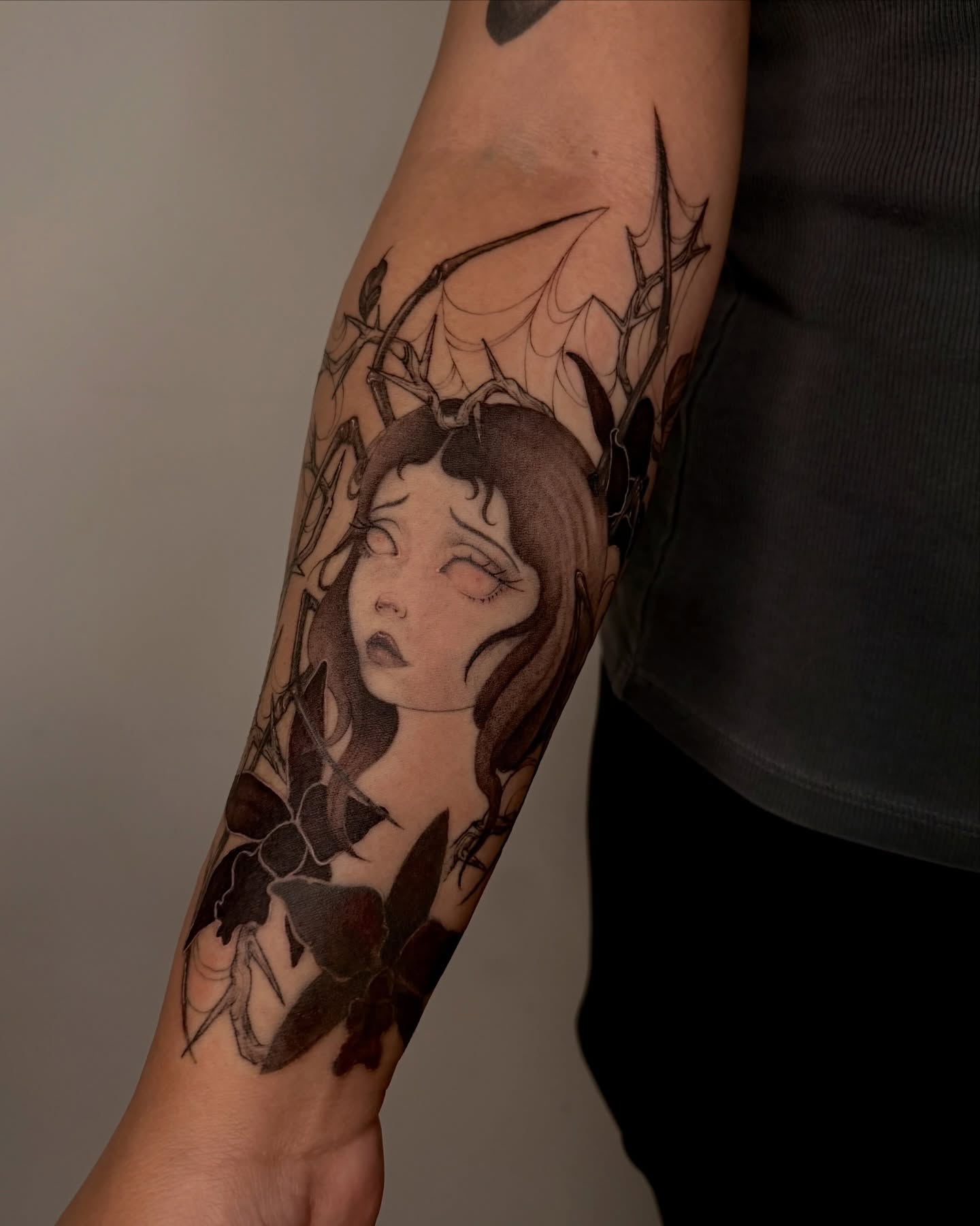 Woman with horns dark realism tattoo on the forearm by Sab