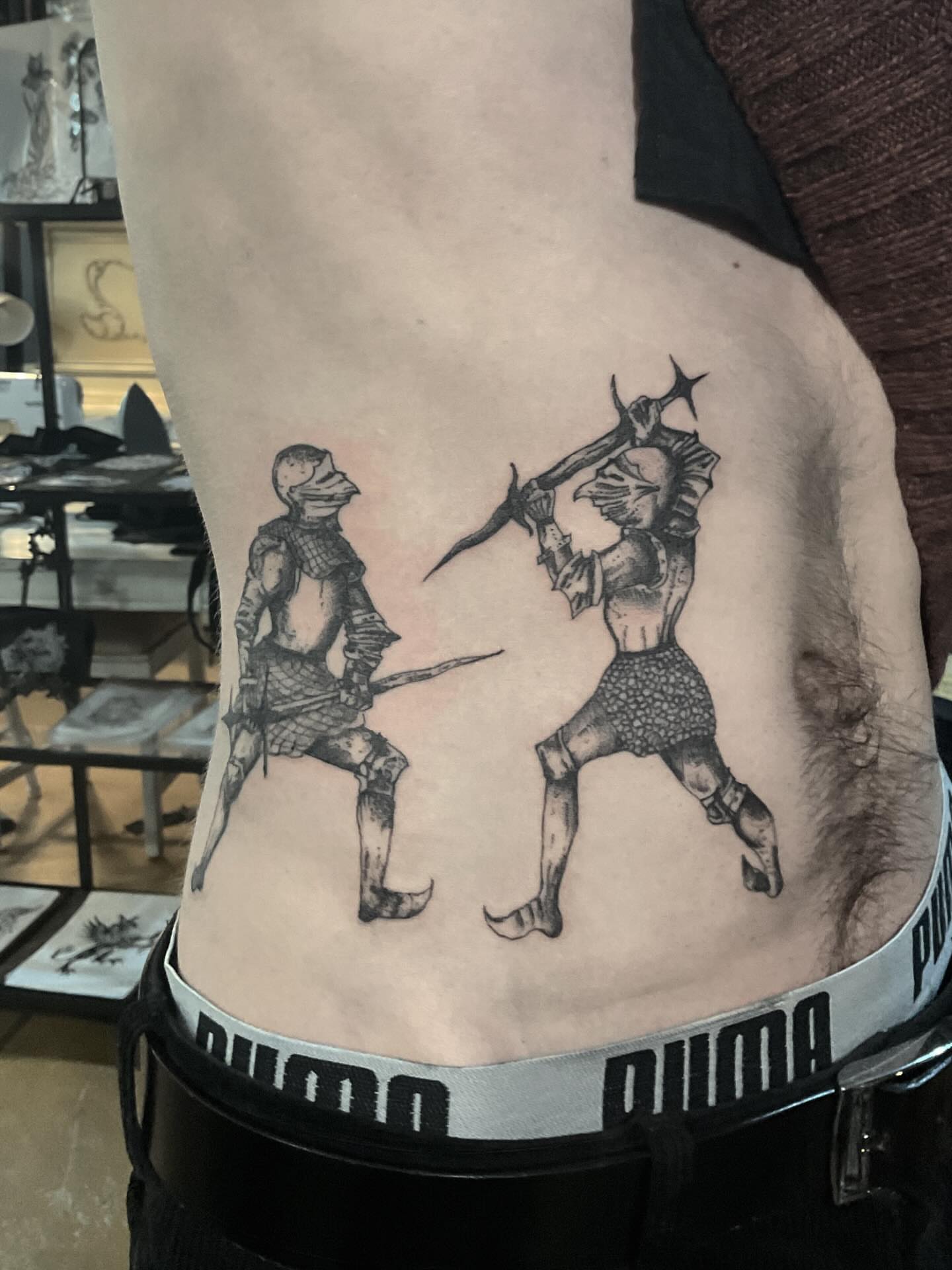 Dueling knights black and grey tattoo on the ribs by ๐ญ๐๐๐๐