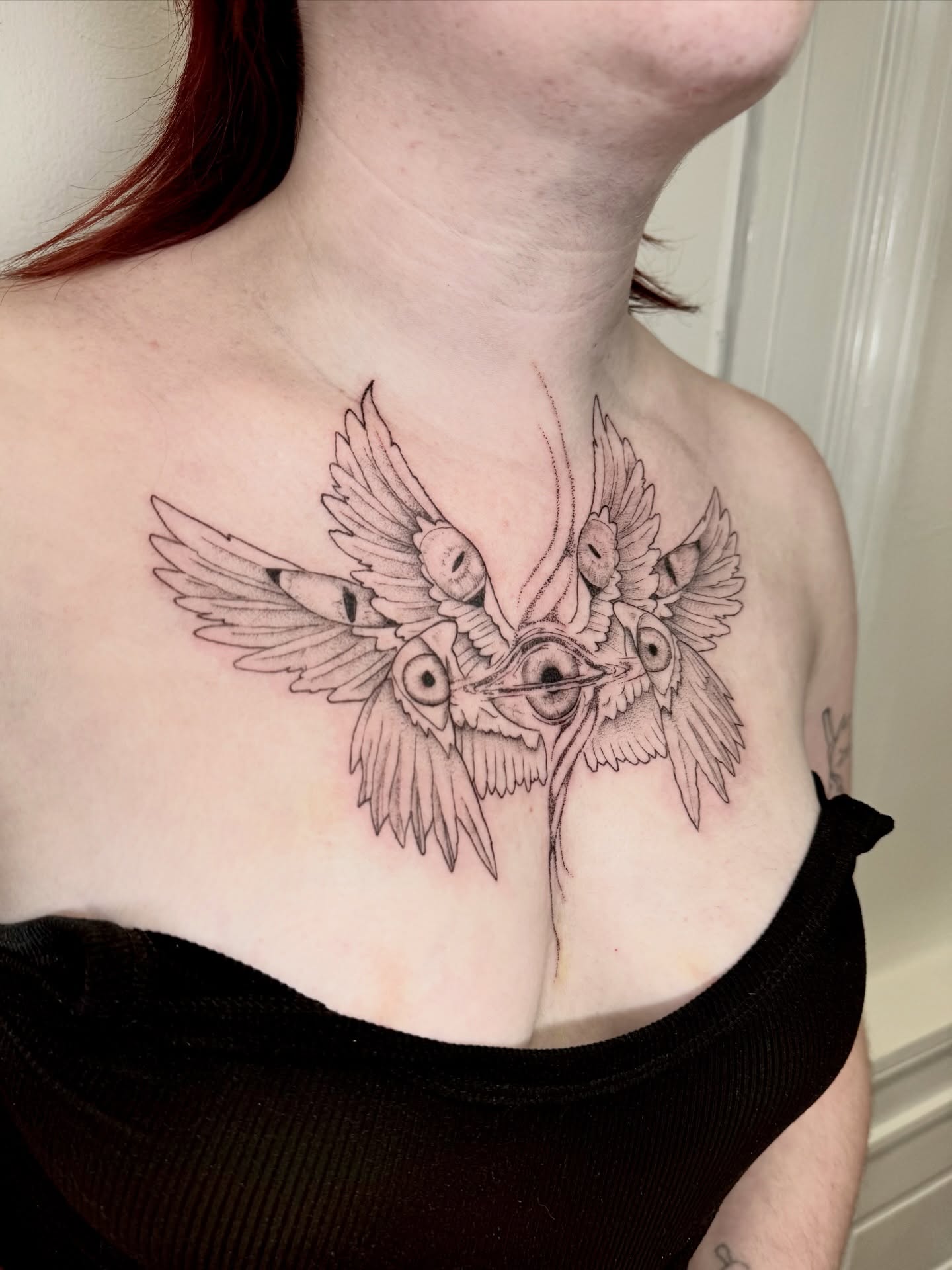 Owl black and grey tattoo on the chest by Ian Saner