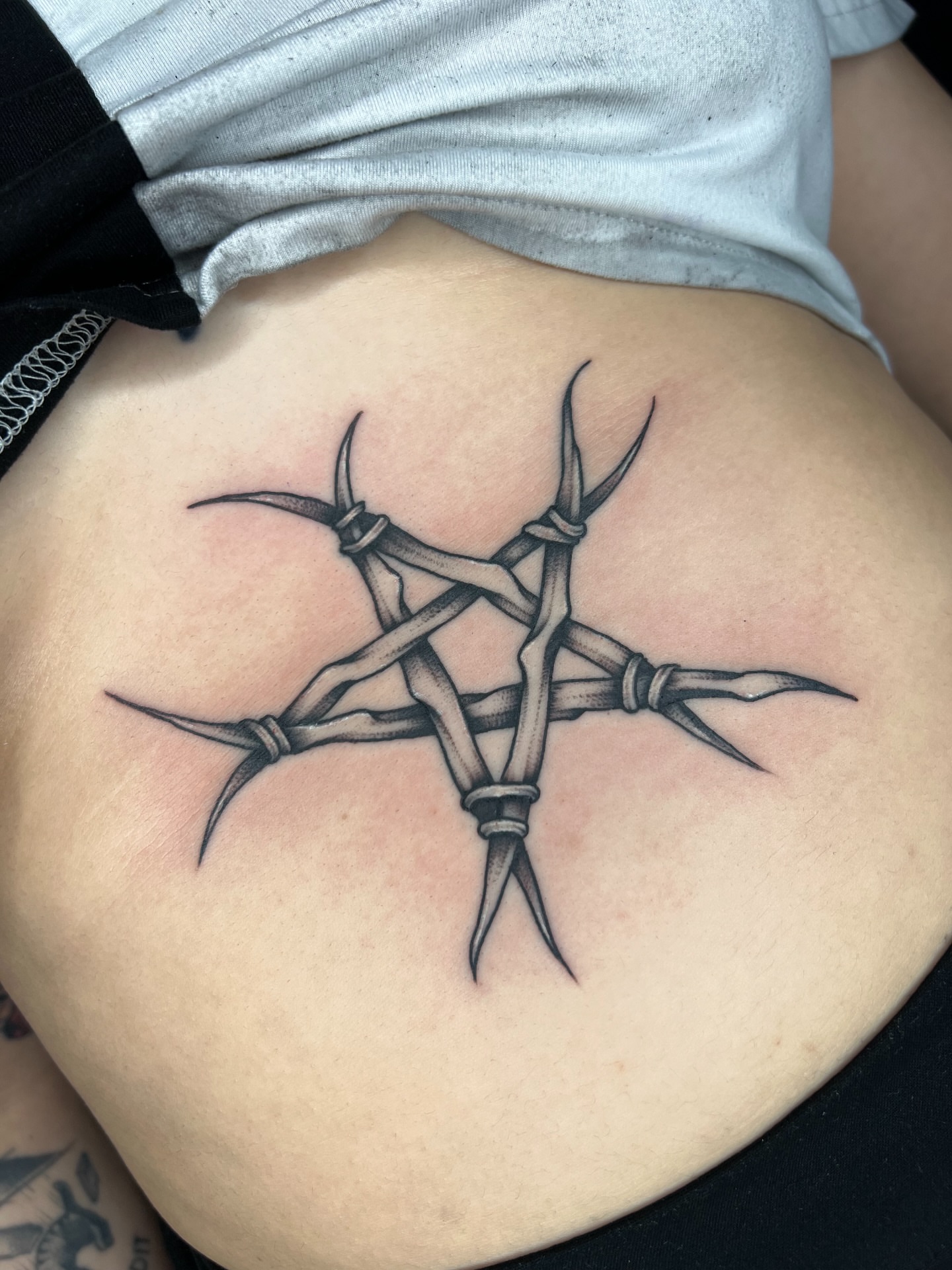 Pentagram black and grey tattoo on the torso by 𝔐𝔦𝔠𝔥𝔢𝔩𝔩𝔢 ℭ𝔥𝔞𝔪𝔢𝔯𝔩𝔦𝔨