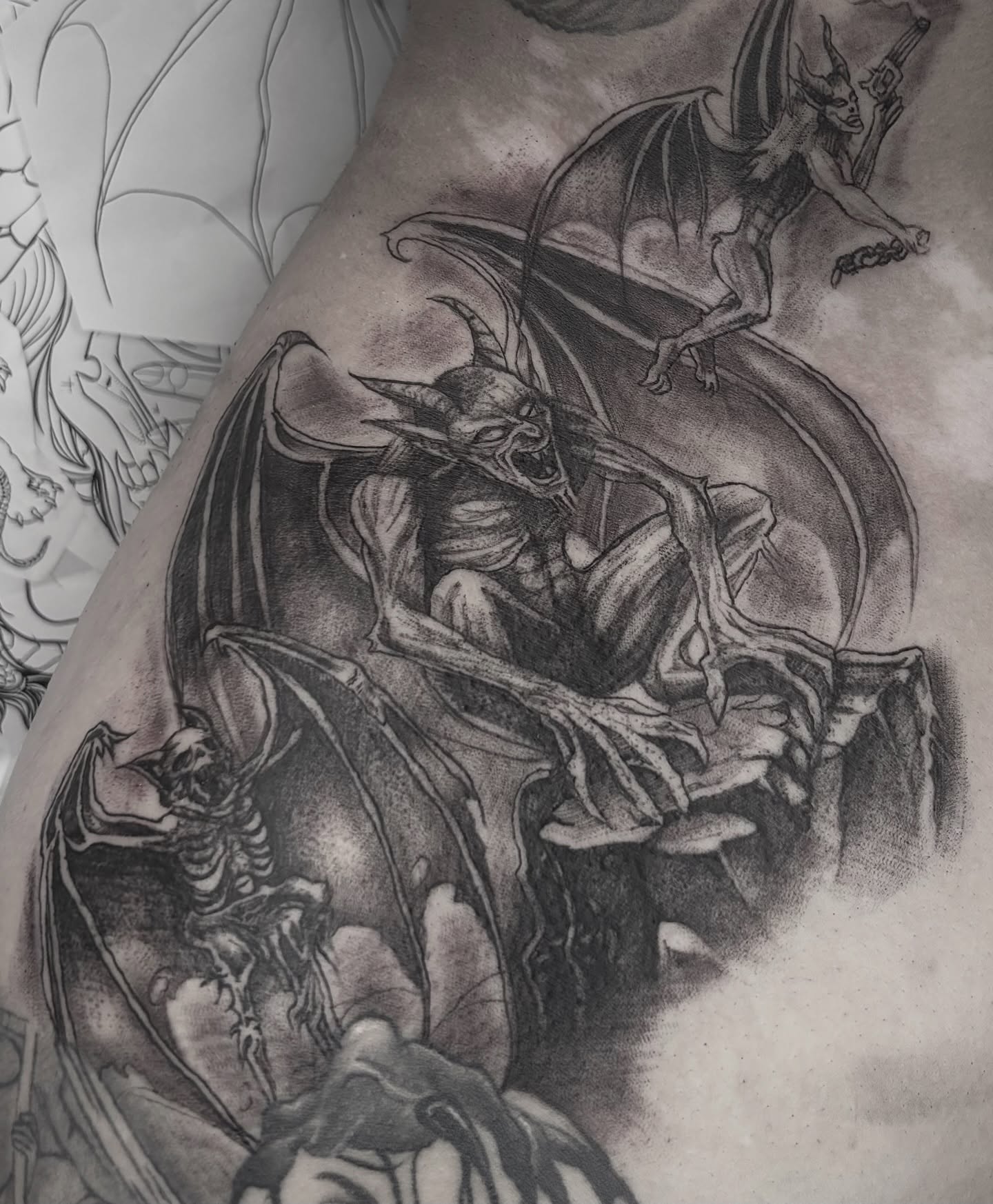 Demon and skeleton dark realism tattoo on the shoulder by Weho Tattoo Artist Lupe