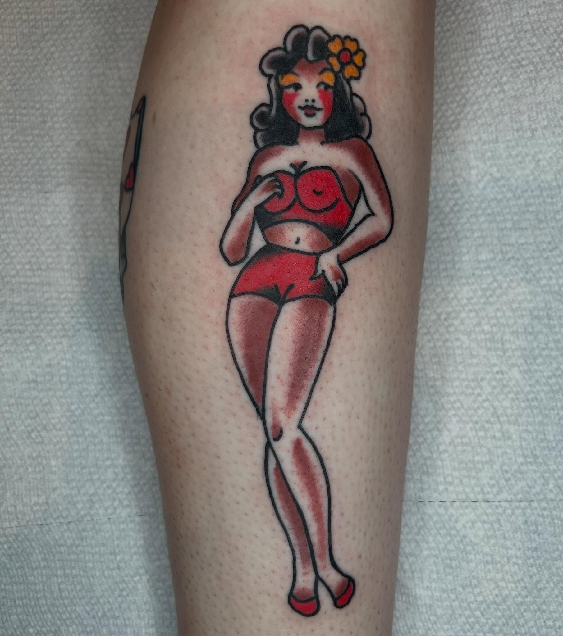 Pin-up girl American traditional tattoo on the leg by Casey Lewis - Tattoo Artist, Cleveland Ohio