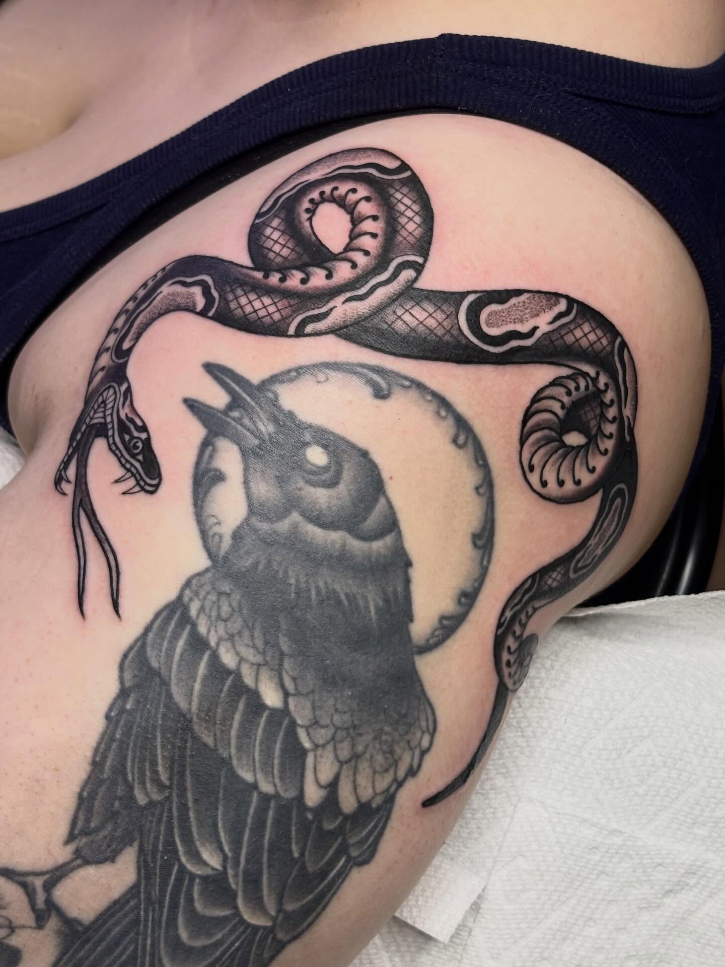 Owl and snake black and grey tattoo on the chest by Sydney Pflaumer