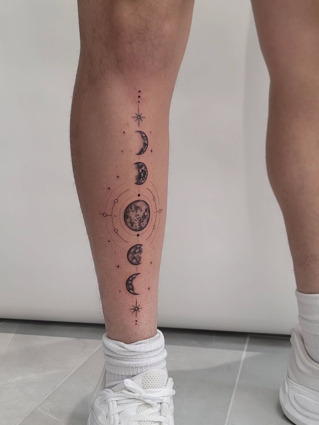 Geometric tattoo on the calf by Las Vegas Fine Line Tattoos