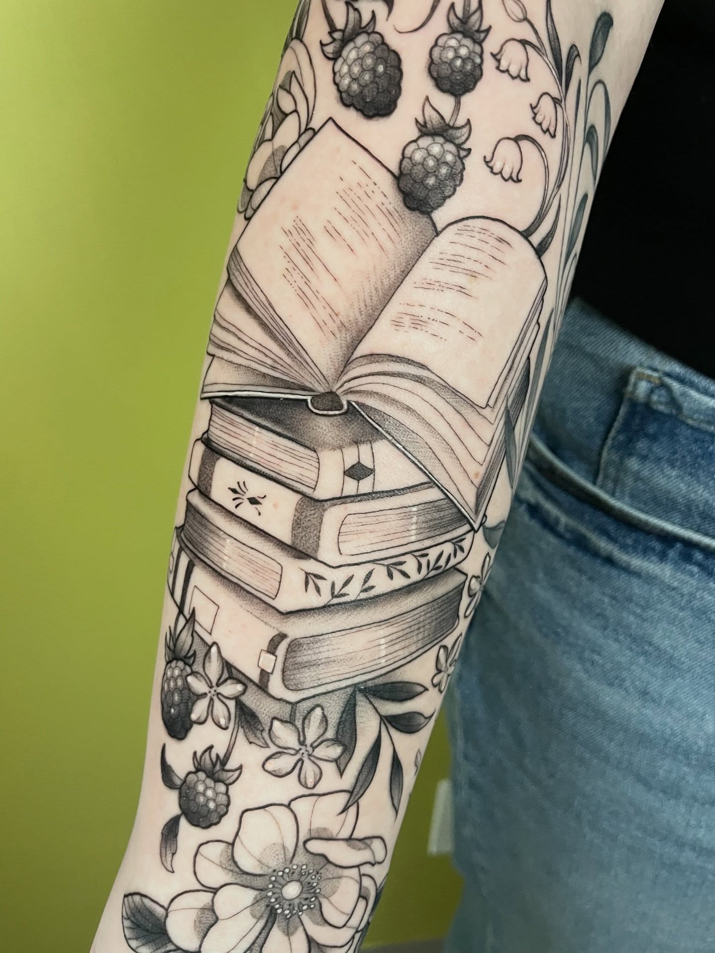 Book and flowers black and grey tattoo on the forearm by ✨Erin Haines✨