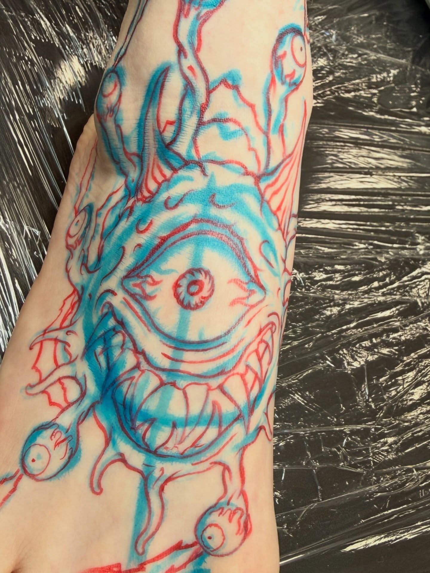 Eye surrealism tattoo on the forearm by Dave Osrowitz