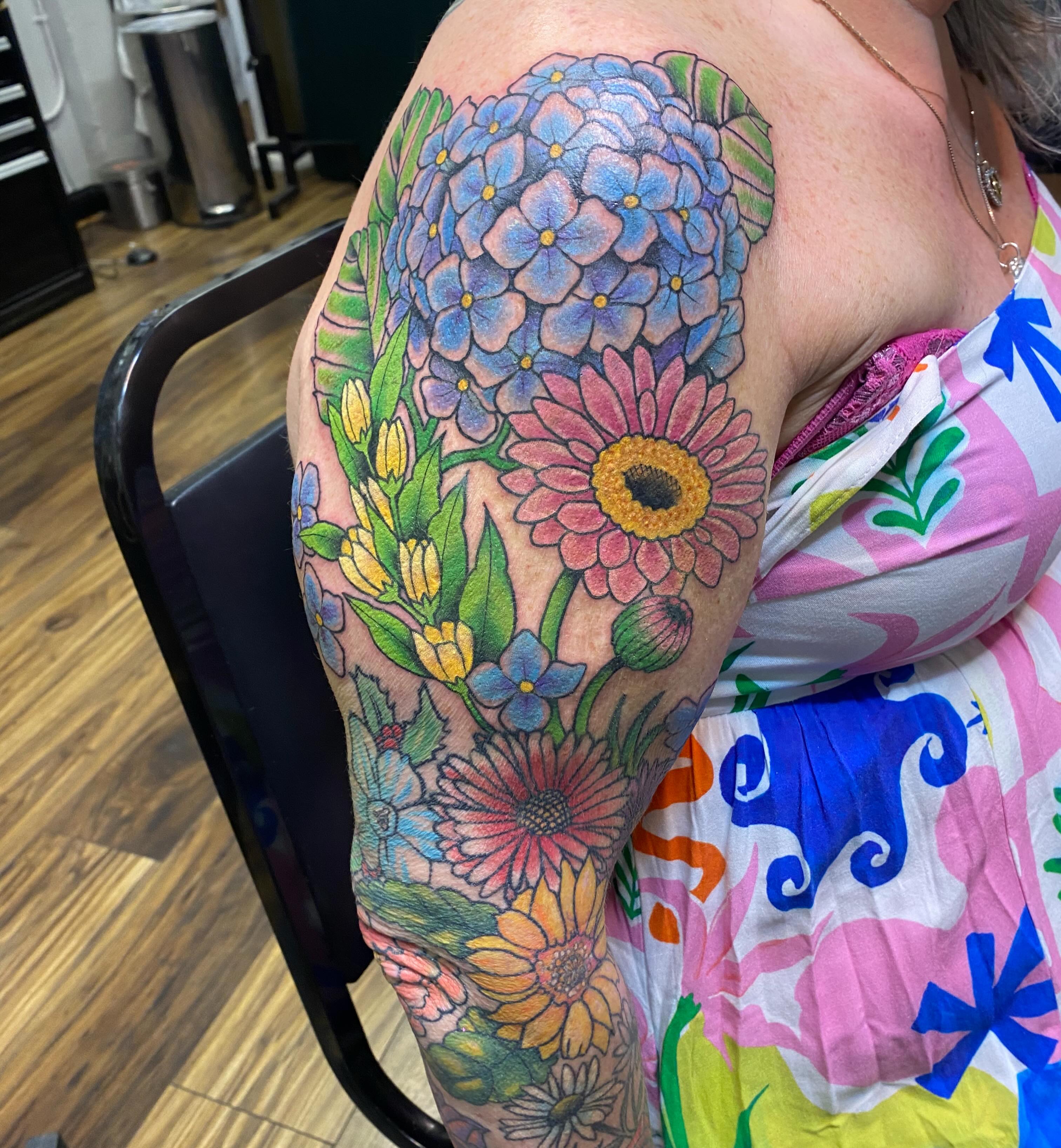 Floral bouquet new school tattoo on the upper arm by Vivian HavaTattoo, Richmond, Virginia