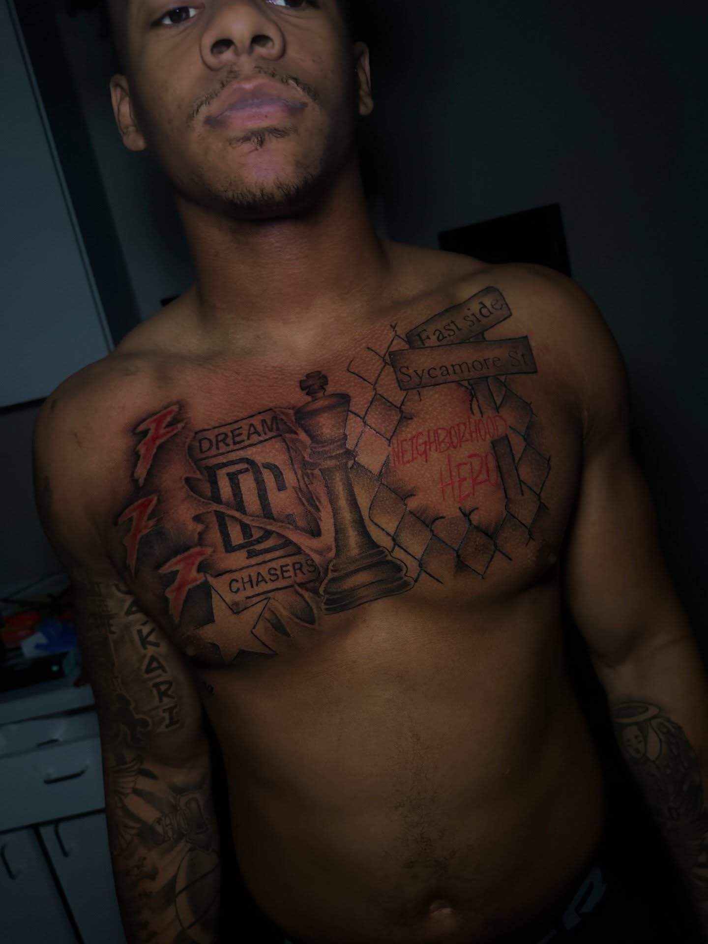 Chess piece and street signs American traditional tattoo on the chest by @tattedbytuck
